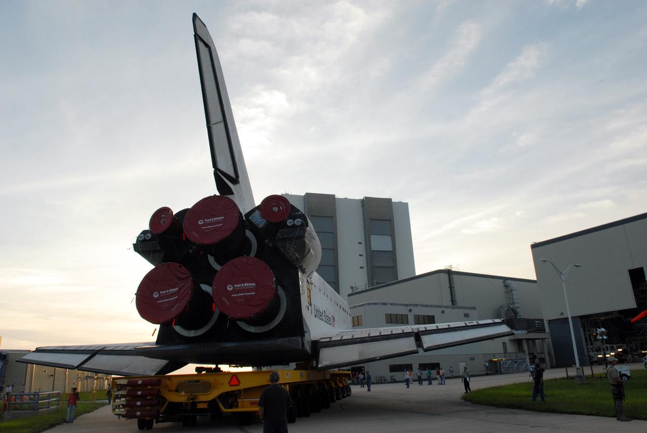 CAPE CANAVERAL, Fla. – Moved by the orbiter transporter, space shuttle Endeavour turns away from Orbiter Processing Facility 2 after rolling out to head to the Vehicle Assembly Building at NASA's Kennedy Space Center. First motion was 7:01 a.m. EDT. In the VAB, Endeavour will be attached to its external fuel tank and twin solid rocket boosters. After additional preparations are made, the shuttle will be rolled out to Launch Pad 39B. Endeavour is the backup shuttle, if needed for rescue, for space shuttle Atlantis’ STS-125 mission to NASA’s Hubble Space Telescope targeted for October. Photo credit: NASA/Troy Cryder