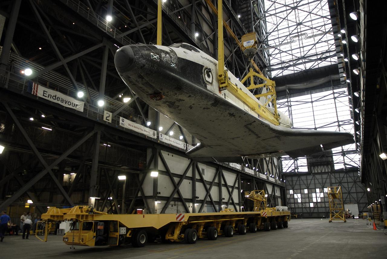 CAPE CANAVERAL, Fla. – Space shuttle Endeavour is raised off the orbiter transporter by an overhead crane in the transfer aisle of the Vehicle Assembly Building at NASA’s Kennedy Space Center. The shuttle will be lifted into high bay 1 for mating with its external fuel tank and solid rocket boosters. After additional preparations are made, the shuttle will be rolled out to Launch Pad 39B. Endeavour is designated the rescue spacecraft for space shuttle Atlantis’ STS-125 mission to NASA’s Hubble Space Telescope, targeted for October. After Atlantis has safely returned from its flight, Endeavour will be moved to Launch Pad 39A for its STS-126 mission to the International Space Station, targeted for November. Photo credit: NASA/Kim Shiflett