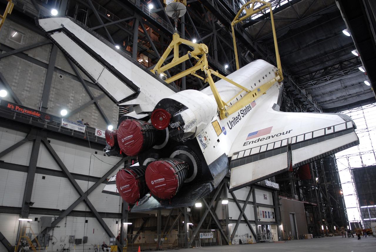 CAPE CANAVERAL, Fla. - Suspended by an overhead crane, space shuttle Endeavour is being raised to a vertical position n the transfer aisle of the Vehicle Assembly Building at NASA’s Kennedy Space Center. The shuttle will be lifted into high bay 1 for mating with its external fuel tank and solid rocket boosters. After additional preparations are made, the shuttle will be rolled out to Launch Pad 39B. Endeavour is designated the rescue spacecraft for space shuttle Atlantis’ STS-125 mission to NASA’s Hubble Space Telescope, targeted for October. After Atlantis has safely returned from its flight, Endeavour will be moved to Launch Pad 39A for its STS-126 mission to the International Space Station, targeted for November. Photo credit: NASA/Kim Shiflett
