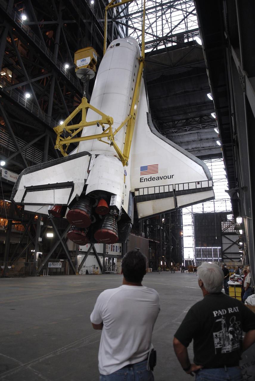 CAPE CANAVERAL, Fla. - Suspended by an overhead crane, space shuttle Endeavour is being raised to a vertical position in the transfer aisle of the Vehicle Assembly Building at NASA’s Kennedy Space Center. The shuttle will be lifted into high bay 1 for mating with its external fuel tank and solid rocket boosters. After additional preparations are made, the shuttle will be rolled out to Launch Pad 39B. Endeavour is designated the rescue spacecraft for space shuttle Atlantis’ STS-125 mission to NASA’s Hubble Space Telescope, targeted for October. After Atlantis has safely returned from its flight, Endeavour will be moved to Launch Pad 39A for its STS-126 mission to the International Space Station, targeted for November. Photo credit: NASA/Kim Shiflett