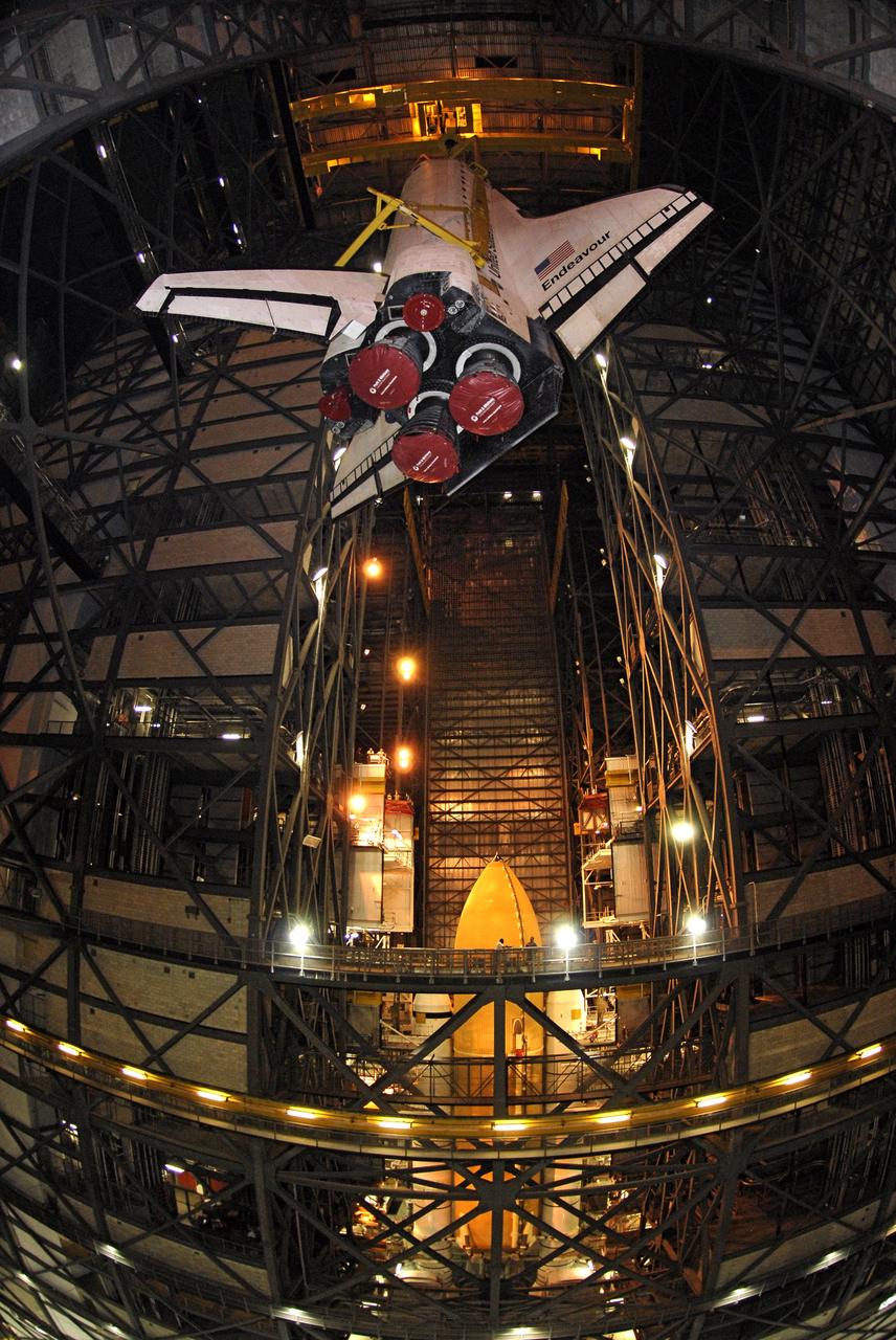 CAPE CANAVERAL, Fla. - At NASA’s Kennedy Space Center, space shuttle Endeavour is slowly lifted into the upper levels of the Vehicle Assembly Building for transfer into high bay 1 for mating with its external fuel tank and solid rocket boosters, seen below it. After additional preparations are made, the shuttle will be rolled out to Launch Pad 39B. Endeavour is designated the rescue spacecraft for space shuttle Atlantis’ STS-125 mission to NASA’s Hubble Space Telescope, targeted for October. After Atlantis has safely returned from its flight, Endeavour will be moved to Launch Pad 39A for its STS-126 mission to the International Space Station, targeted for November. Photo credit: NASA/Kim Shiflett