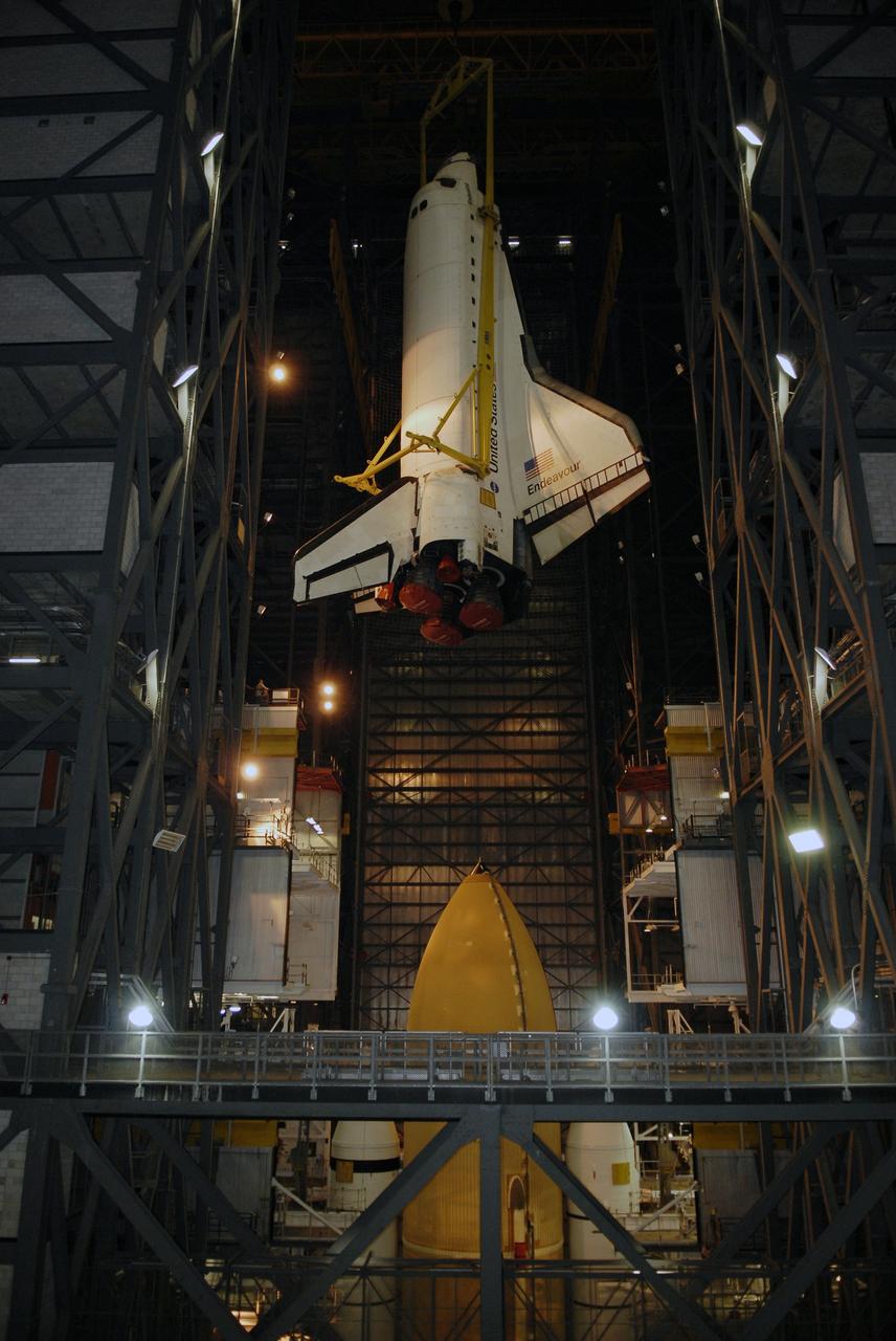 CAPE CANAVERAL, Fla. - At NASA’s Kennedy Space Center, space shuttle Endeavour is lowered into high bay 1 of the Vehicle Assembly Building for mating with its external fuel tank and solid rocket boosters, waiting below. After additional preparations are made, the shuttle will be rolled out to Launch Pad 39B. Endeavour is designated the rescue spacecraft for space shuttle Atlantis’ STS-125 mission to NASA’s Hubble Space Telescope, targeted for October. After Atlantis has safely returned from its flight, Endeavour will be moved to Launch Pad 39A for its STS-126 mission to the International Space Station, targeted for November. Photo credit: NASA/Kim Shiflett