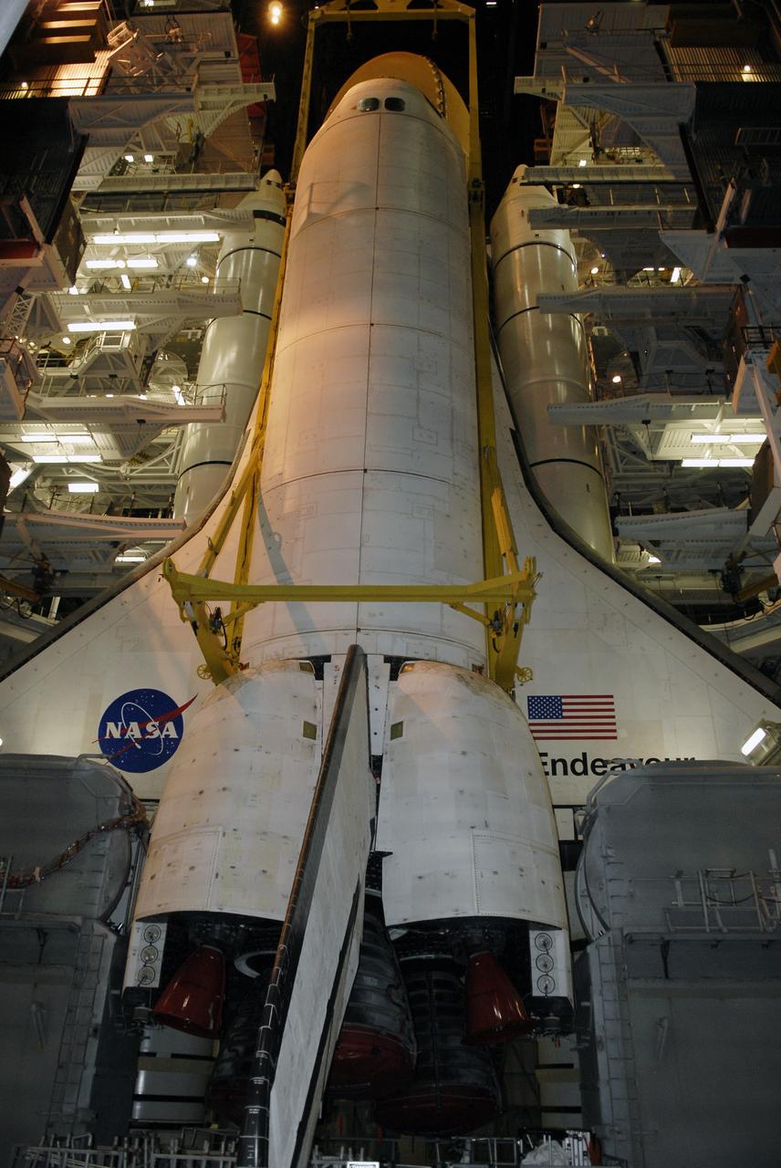 CAPE CANAVERAL, Fla. - In high bay 1 of the Vehicle Assembly Building at NASA’s Kennedy Space Center, space shuttle Endeavour is lowered alongside its external fuel tank and solid rocket boosters for mating. After additional preparations are made, the shuttle will be rolled out to Launch Pad 39B. Endeavour is designated the rescue spacecraft for space shuttle Atlantis’ STS-125 mission to NASA’s Hubble Space Telescope, targeted for October. After Atlantis has safely returned from its flight, Endeavour will be moved to Launch Pad 39A for its STS-126 mission to the International Space Station, targeted for November. Photo credit: NASA/Kim Shiflett