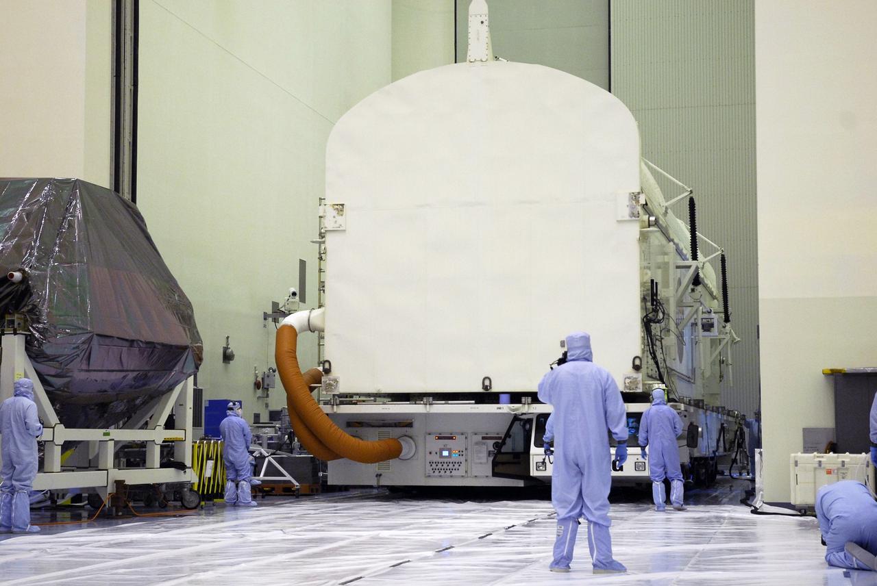 CAPE CANAVERAL, Fla. -  The payload canister backs into the Payload Hazardous Servicing Facility at NASA’s Kennedy Space Center.  The equipment and carriers associated with the STS-125 mission to service the Hubble Space Telescope will be installed in the canister for transfer to Launch Pad 39A. The canister contains an environmental con¬trol system, signified by the red umbilical lines at left. At the pad, the carriers will be loaded into space shuttle Atlantis’ payload bay.  Launch of Atlantis is targeted for Oct. 10. Photo credit: NASA/Cory Huston