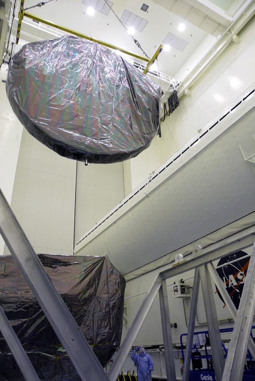 CAPE CANAVERAL, Fla. - In the Payload Hazardous Servicing Facility at NASA’s Kennedy Space Center, an overhead crane moves the Flight Support System carrier with the Soft Capture Mechanism toward the payload canister for transfer to Launch Pad 39A. The carrier is one of four associated with the STS-125 mission to service the Hubble Space Telescope. At the pad, all the carriers will be loaded into space shuttle Atlantis’ payload bay. Launch of Atlantis is targeted for Oct. 10. Photo credit: NASA/Cory Huston