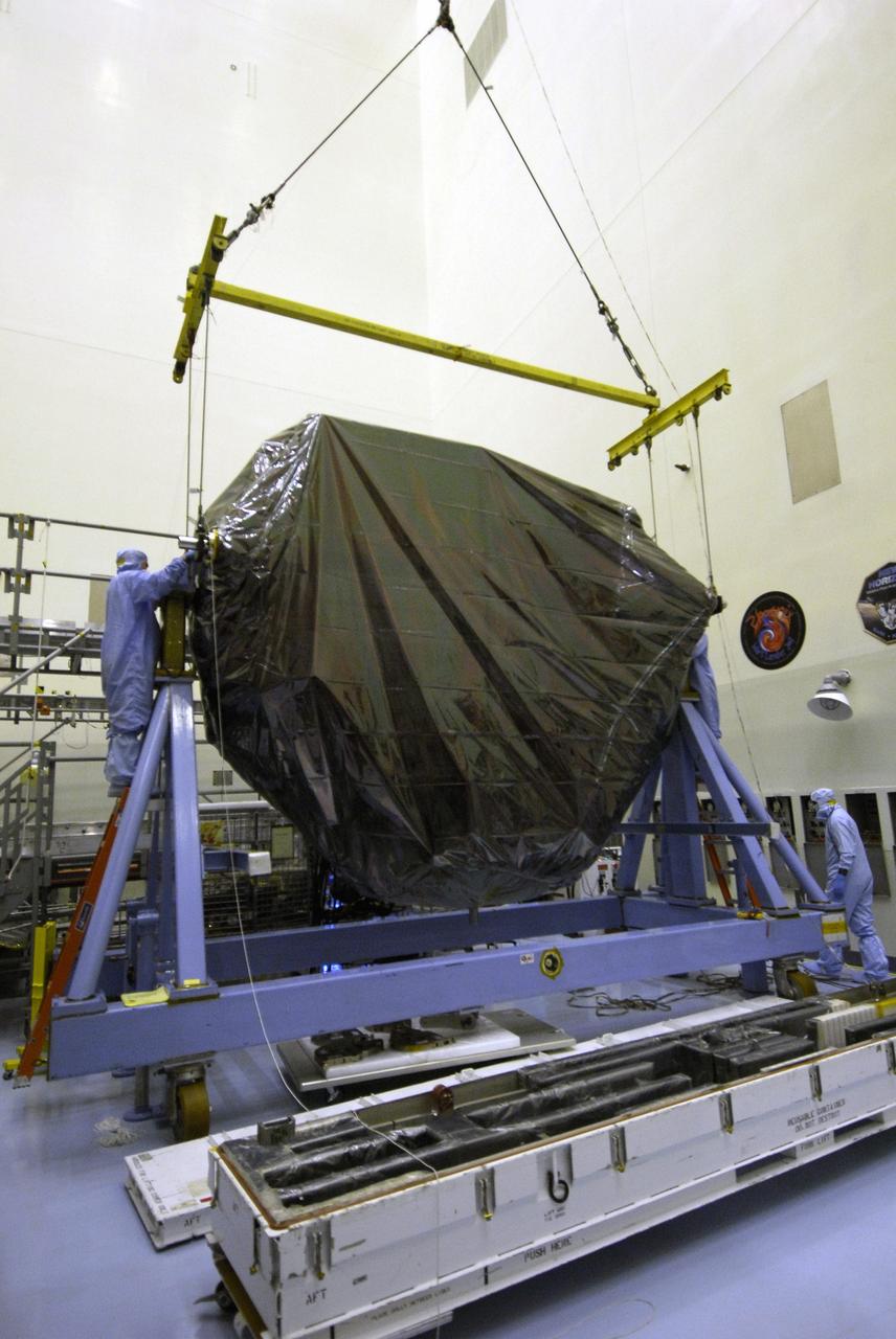 CAPE CANAVERAL, Fla. -  In the Payload Hazardous Servicing Facility at NASA’s Kennedy Space Center, an overhead crane lifts the Multi-Use Logistic Equipment, or MULE, carrier. The carrier is one of four associated with the STS-125 mission to service the Hubble Space Telescope.  It will be installed in the payload canister for transfer to Launch Pad 39A. At the pad, all the carriers will be loaded into space shuttle Atlantis’ payload bay.  Launch of Atlantis is targeted for Oct. 10. Photo credit: NASA/Jack Pfaller