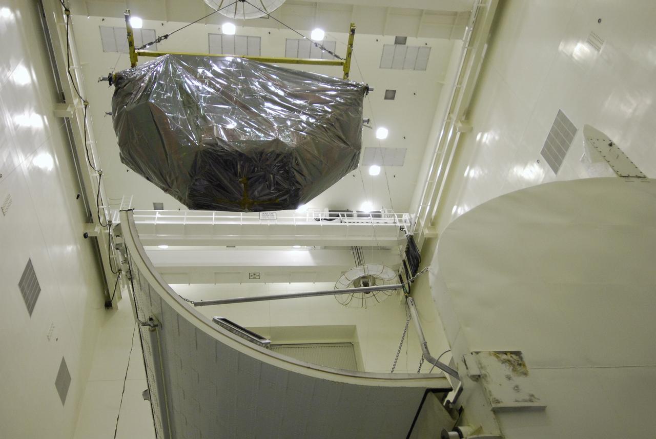 CAPE CANAVERAL, Fla. - In the Payload Hazardous Servicing Facility at NASA’s Kennedy Space Center, the Multi-Use Logistic Equipment, or MULE, carrier is moved toward the payload canister. The carrier is one of four associated with the STS-125 mission to service the Hubble Space Telescope. It will be installed in the payload canister for transfer to Launch Pad 39A. At the pad, all the carriers will be loaded into space shuttle Atlantis’ payload bay. Launch of Atlantis is targeted for Oct. 10. Photo credit: NASA/Jack Pfaller