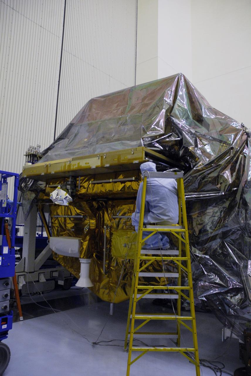 CAPE CANAVERAL, Fla. - In the Payload Hazardous Servicing Facility at NASA's Kennedy Space Center, the protective cover is being replaced on the Super Lightweight Interchangeable Carrier, or SLIC. The cover was removed to clean the carrier of contaminants found Sept. 17 during preparations to deliver NASA's Hubble Space Telescope servicing payload to Launch Pad 39A. Cleanliness is extremely important for space shuttle Atlantis’ STS-125 mission to Hubble, and the teams have insured that the SLIC is ready to fly. The SLIC, which holds battery module assemblies, is built with state-of-the-art, lightweight, composite materials - carbon fiber with a cyanate ester resin and a titanium metal matrix composite. These composites have greater strength-to-mass ratios than the metals typically used in spacecraft design. The carrier is one of four being transferred to Launch Pad 39A. At the pad, the carriers will be loaded into Atlantis’ payload bay. Launch of Atlantis is targeted for Oct. 10. Photo credit: NASA/Jack Pfaller