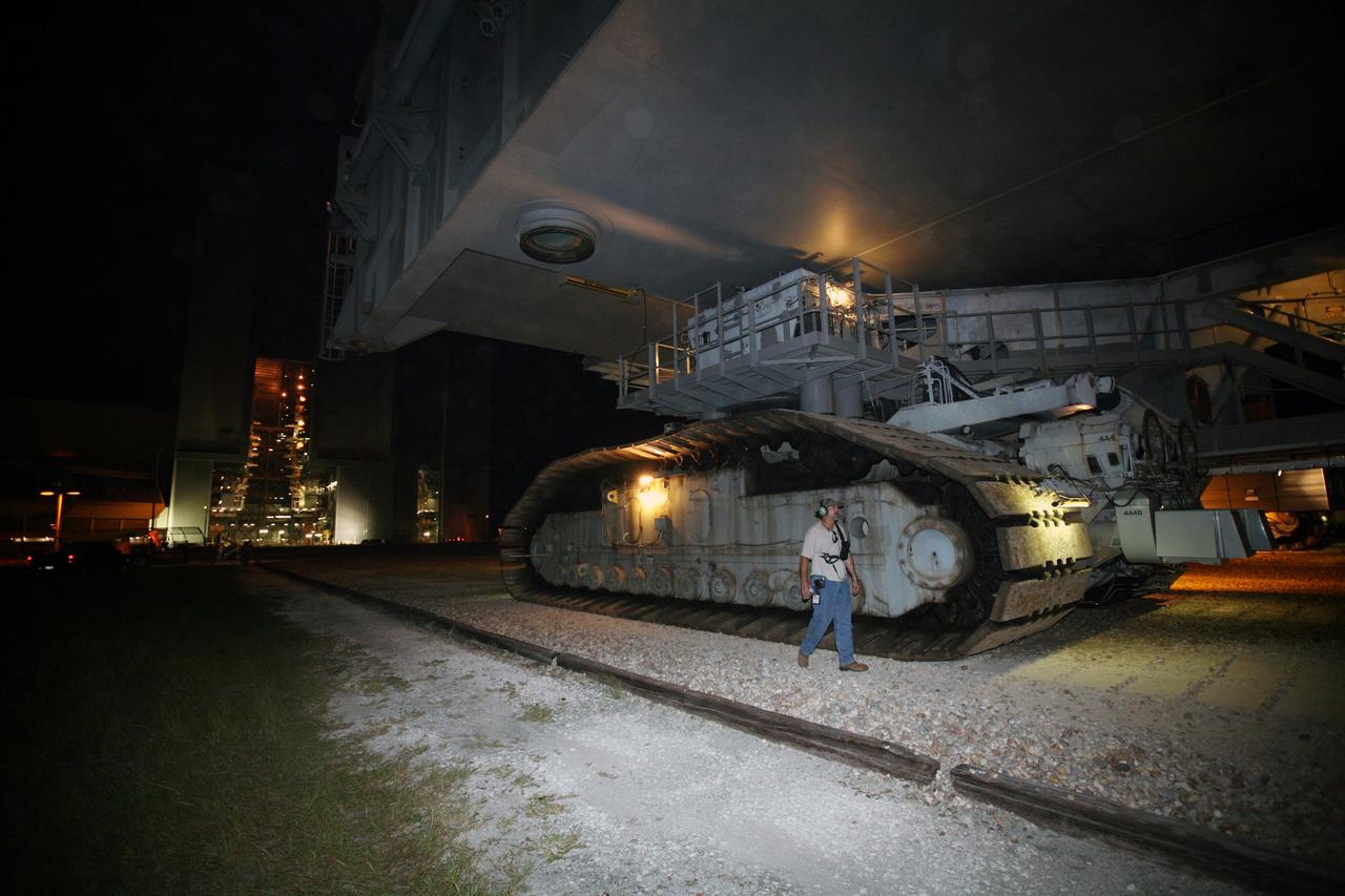 CAPE CANAVERAL, Fla. -   With the Vehicle Assembly Building at NASA's Kennedy Space Center left behind (at left), the crawler-transporter slowly rolls along the crawlerway with space shuttle Endeavour on top. First motion was at 11:15 p.m. Sept. 18. Endeavour completed the 4.2-mile journey to Launch Pad 39B on Sept. 19 at 6:59 a.m. EDT. For the first time since July 2001, two shuttles are on the launch pads at the same time at the center. Endeavour will stand by at pad B in the unlikely event that a rescue mission is necessary during space shuttle Atlantis' upcoming mission to repair NASA's Hubble Space Telescope, targeted to launch Oct. 10. After Endeavour is cleared from its duty as a rescue spacecraft, it will be moved to Launch Pad 39A for the STS-126 mission to the International Space Station. That flight is targeted for launch Nov. 12. Photo credit: NASA/Dimitri Gerondidakis