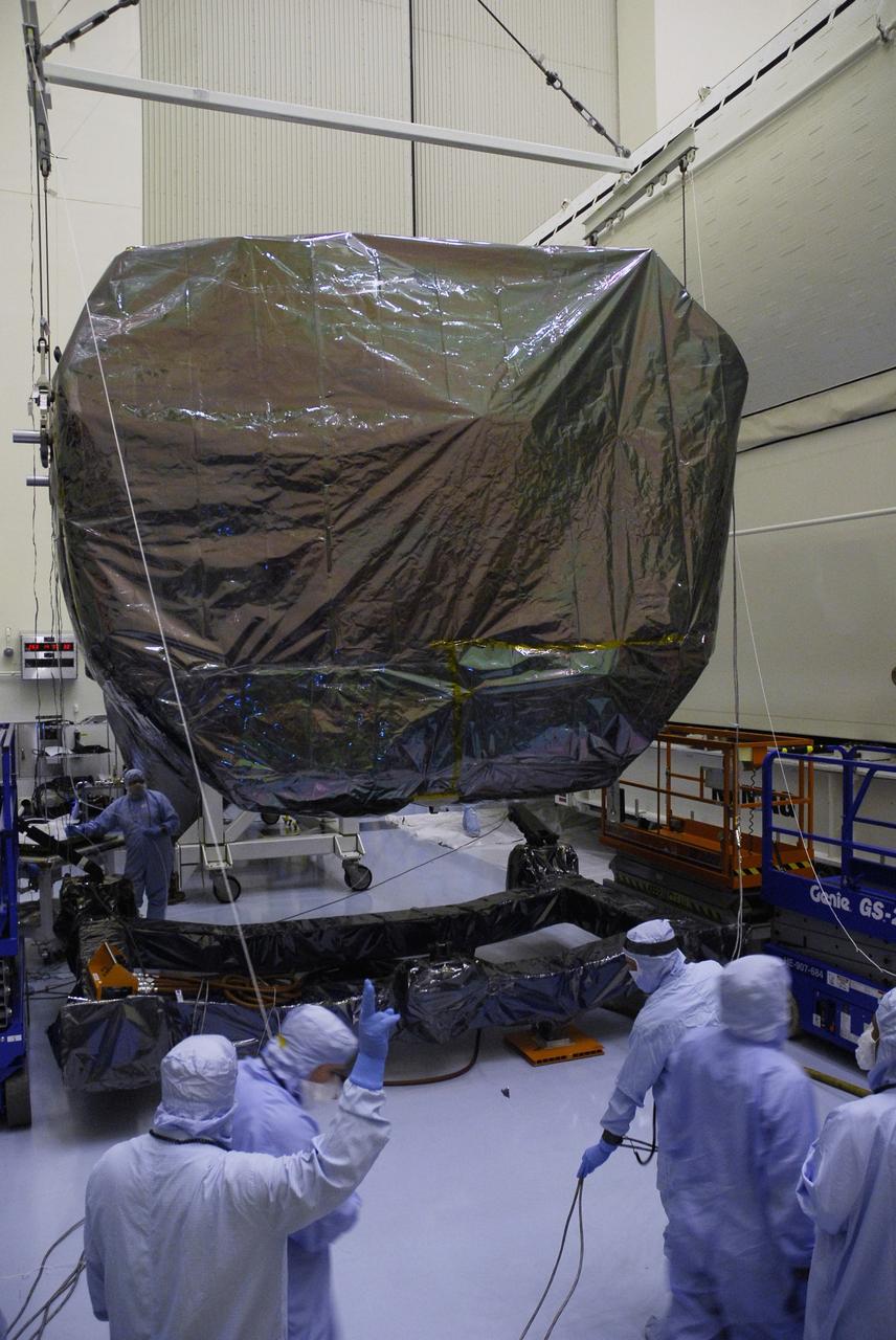 CAPE CANAVERAL, Fla. -  In the Payload Hazardous Servicing Facility at NASA's Kennedy Space Center, workers are ready to lift the Orbital Replacement Unit Carrier, or ORUC, to the payload canister. The carrier is one of four associated with the STS-125 mission to service the Hubble Space Telescope. It will be installed in the payload canister for transfer to Launch Pad 39A. At the pad, all the carriers will be loaded into space shuttle Atlantis’ payload bay. Launch of Atlantis is targeted for Oct. 10.  Photo credit: NASA/Jack Pfaller