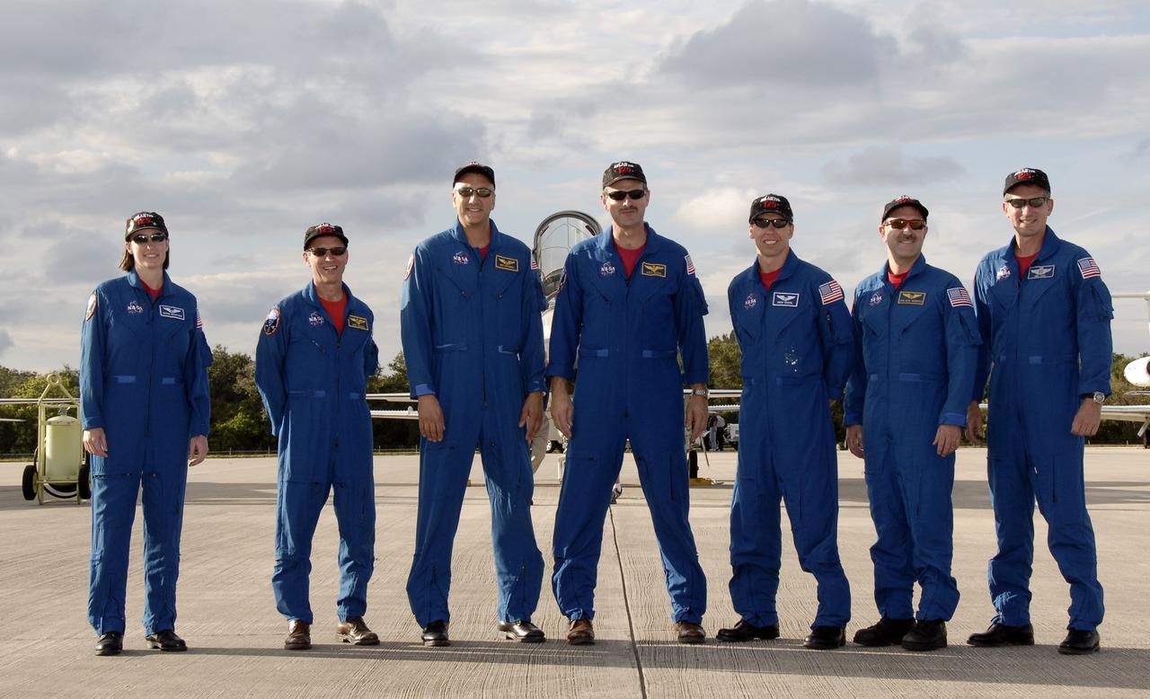 CAPE CANAVERAL, Fla. -  The STS-125 crew members prepare to speak to the media at the Shuttle Landing Facility at NASA’s Kennedy Space Center in Florida after arriving in T-38 jets for Terminal Countdown Demonstration Test, or TCDT, activities. From left are, mission specialist Megan McArthur, pilot Gregory C. Johnson, mission specialist Mike Massimino, commander Scott Altman, and mission specialists Andrew Feustel, John Grunsfeld and Michael Good. During TCDT, space shuttle Atlantis’ STS-125 crew members will participate in a simulated launch countdown, practice emergency egress procedures at the launch pad and continue to familiarize themselves with the mission payload and hardware. STS-125 is the fifth and final shuttle Hubble Space Telescope servicing mission. Launch is targeted for Oct. 10. Photo credit: NASA/Kim Shiflett
