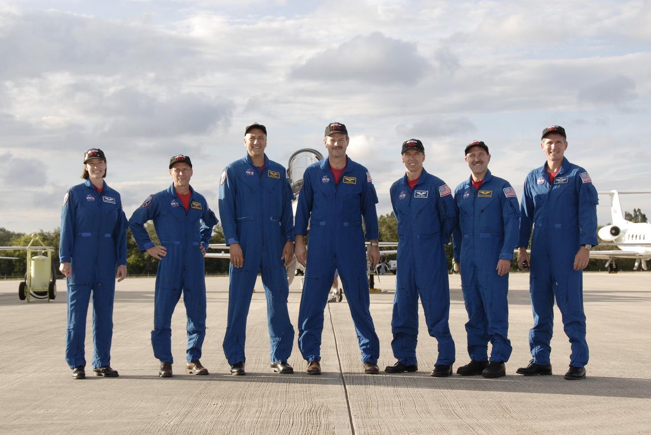 CAPE CANAVERAL, Fla. -  The STS-125 crew members prepare to speak to the media at the Shuttle Landing Facility at NASA’s Kennedy Space Center in Florida after arriving in T-38 jets for Terminal Countdown Demonstration Test, or TCDT, activities. From left are, mission specialist Megan McArthur, pilot Gregory C. Johnson, mission specialist Mike Massimino, commander Scott Altman, and mission specialists Andrew Feustel, John Grunsfeld and Michael Good. During TCDT, space shuttle Atlantis’ STS-125 crew members will participate in a simulated launch countdown, practice emergency egress procedures at the launch pad and continue to familiarize themselves with the mission payload and hardware. STS-125 is the fifth and final shuttle Hubble Space Telescope servicing mission. Launch is targeted for Oct. 10. Photo credit: NASA/Kim Shiflett