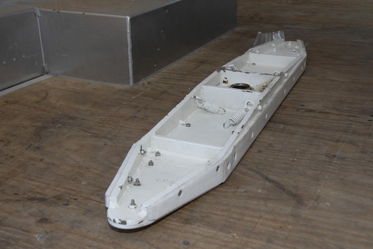 CAPE CANAVERAL, Fla. -  Technicians removed a “shoe” on the Hubble payload canister at Launch pad 39A at NASA’s Kennedy Space Center in Florida. The canister arrived at the pad on Saturday evening; however, early Sunday morning technicians were unable to place the canister into the pad’s payload changeout room for space shuttle Atlantis’ STS-125 mission. Teflon pads on the “shoes” attached to the outside of the payload canister that help the canister move along the guide rails didn’t fit properly. The shoes were removed and several options were considered, including slightly shaving down the pads so the shoes will fit onto the rails.  STS-125 is the fifth and final shuttle Hubble Space Telescope servicing mission. Atlantis’ launch is targeted for Oct. 10. Photo credit: NASA/Kim Shiflett.