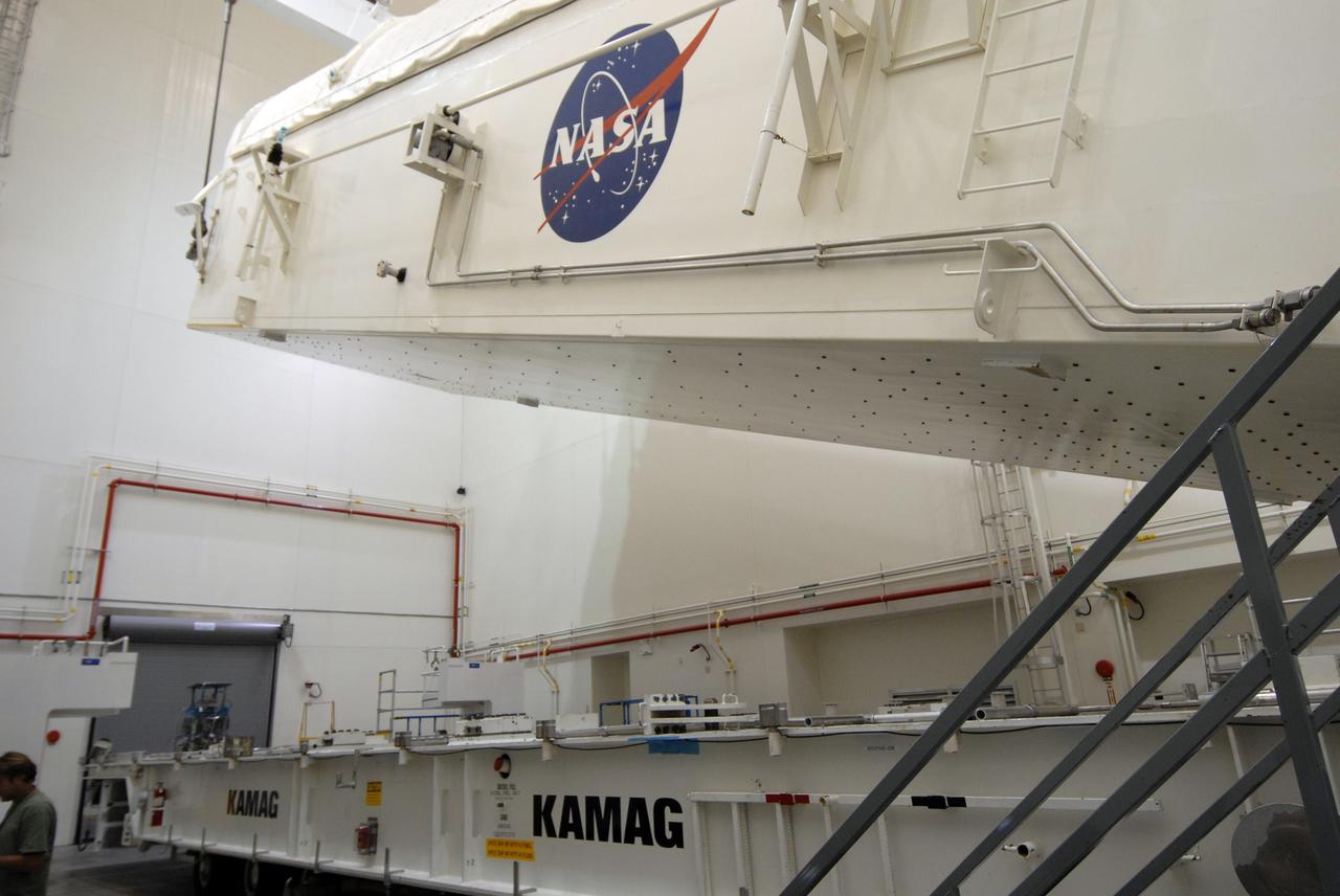 CAPE CANAVERAL, Fla. -  In the Canister Rotation Facility at NASA's Kennedy Space Center, the payload canister is lifted toward a vertical position for the trip to Launch Pad 39A. The canister’s cargo consists of four carriers holding various equipment for the STS-125 mission aboard space shuttle Atlantis to service NASA’s Hubble Space Telescope. At the pad, the cargo will be moved into the Payload Changeout Room.  The changeout room is the enclosed, environmentally controlled portion of the rotating service structure that supports cargo delivery to the pad and subsequent vertical installation into the shuttle’s payload bay. Launch of Atlantis is targeted for Oct. 10.   Photo credit: NASA/Jack Pfaller