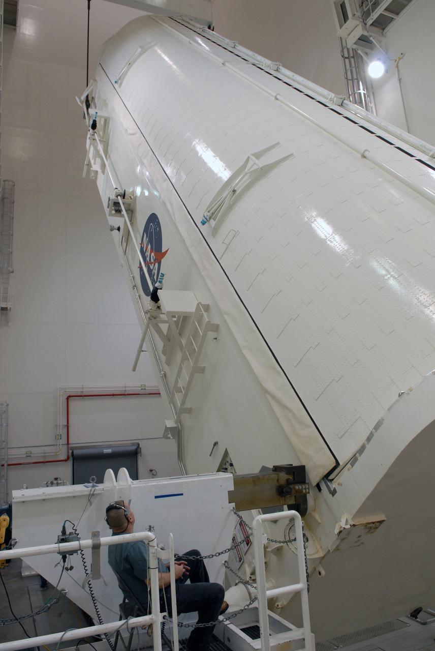 CAPE CANAVERAL, Fla. -  In the Canister Rotation Facility at NASA's Kennedy Space Center, the payload canister is lifted toward a vertical position for the trip to Launch Pad 39A. The canister’s cargo consists of four carriers holding various equipment for the STS-125 mission aboard space shuttle Atlantis to service NASA’s Hubble Space Telescope.  At the pad, the cargo will be moved into the Payload Changeout Room.  The changeout room is the enclosed, environmentally controlled portion of the rotating service structure that supports cargo delivery to the pad and subsequent vertical installation into the shuttle’s payload bay. Launch of Atlantis is targeted for Oct. 10.   Photo credit: NASA/Jack Pfaller