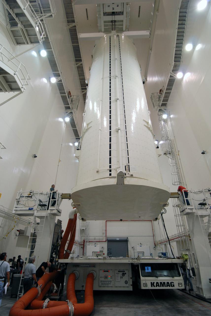 CAPE CANAVERAL, Fla. -   In the Canister Rotation Facility at NASA's Kennedy Space Center, the payload canister is lifted to a vertical position for the trip to Launch Pad 39A. The canister’s cargo consists of four carriers holding various equipment for the STS-125 mission aboard space shuttle Atlantis to service NASA’s Hubble Space Telescope.  At the pad, the cargo will be moved into the Payload Changeout Room.  The changeout room is the enclosed, environmentally controlled portion of the rotating service structure that supports cargo delivery to the pad and subsequent vertical installation into the shuttle’s payload bay. Launch of Atlantis is targeted for Oct. 10.   Photo credit: NASA/Jack Pfaller