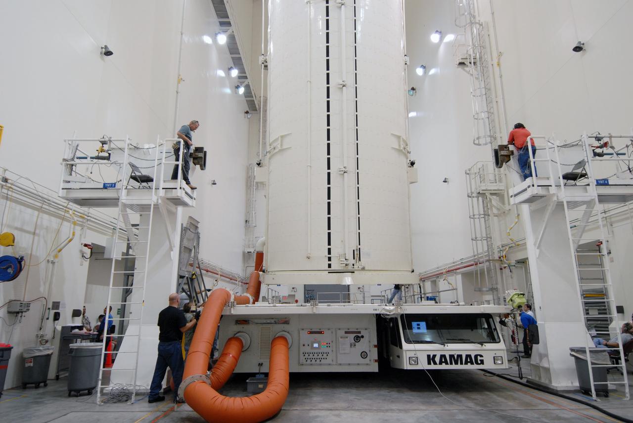 CAPE CANAVERAL, Fla. -    In the Canister Rotation Facility at NASA's Kennedy Space Center, the payload canister is in a vertical position for the trip to Launch Pad 39A. The canister’s cargo consists of four carriers holding various equipment for the STS-125 mission aboard space shuttle Atlantis to service NASA’s Hubble Space Telescope.  At the pad, the cargo will be moved into the Payload Changeout Room.  The changeout room is the enclosed, environmentally controlled portion of the rotating service structure that supports cargo delivery to the pad and subsequent vertical installation into the shuttle’s payload bay. Launch of Atlantis is targeted for Oct. 10.   Photo credit: NASA/Jack Pfaller