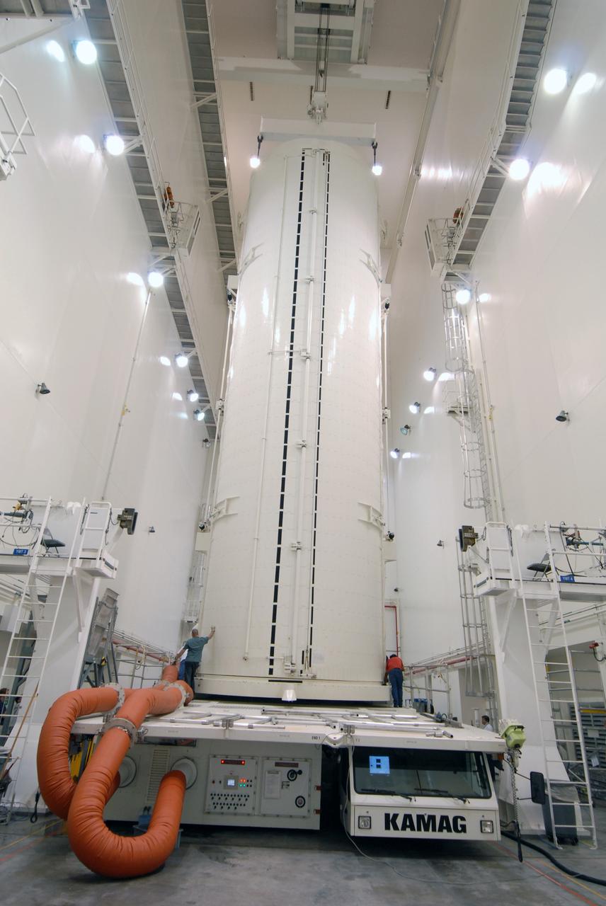 CAPE CANAVERAL, Fla. -   In the Canister Rotation Facility at NASA's Kennedy Space Center, the payload canister is in a vertical position for the trip to Launch Pad 39A. The canister’s cargo consists of four carriers holding various equipment for the STS-125 mission aboard space shuttle Atlantis to service NASA’s Hubble Space Telescope.  At the pad, the cargo will be moved into the Payload Changeout Room.  The changeout room is the enclosed, environmentally controlled portion of the rotating service structure that supports cargo delivery to the pad and subsequent vertical installation into the shuttle’s payload bay. Launch of Atlantis is targeted for Oct. 10.   Photo credit: NASA/Jack Pfaller