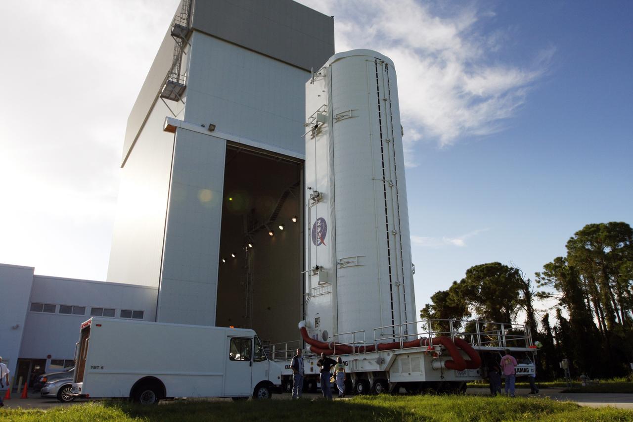 CAPE CANAVERAL, Fla. -  The payload canister moves out of the Canister Rotation Facility at NASA's Kennedy Space Center in Florida heading for Launch Pad 39A.  It carries a cargo of four carriers holding various equipment for the STS-125 mission aboard space shuttle Atlantis to service NASA’s Hubble Space Telescope.   At the pad, the cargo will be moved into the Payload Changeout Room.  The changeout room is the enclosed, environmentally controlled portion of the rotating service structure that supports cargo delivery to the pad and subsequent vertical installation into the shuttle’s payload bay. Launch of Atlantis is targeted for Oct. 10.  Photo credit: NASA/Troy Cryder