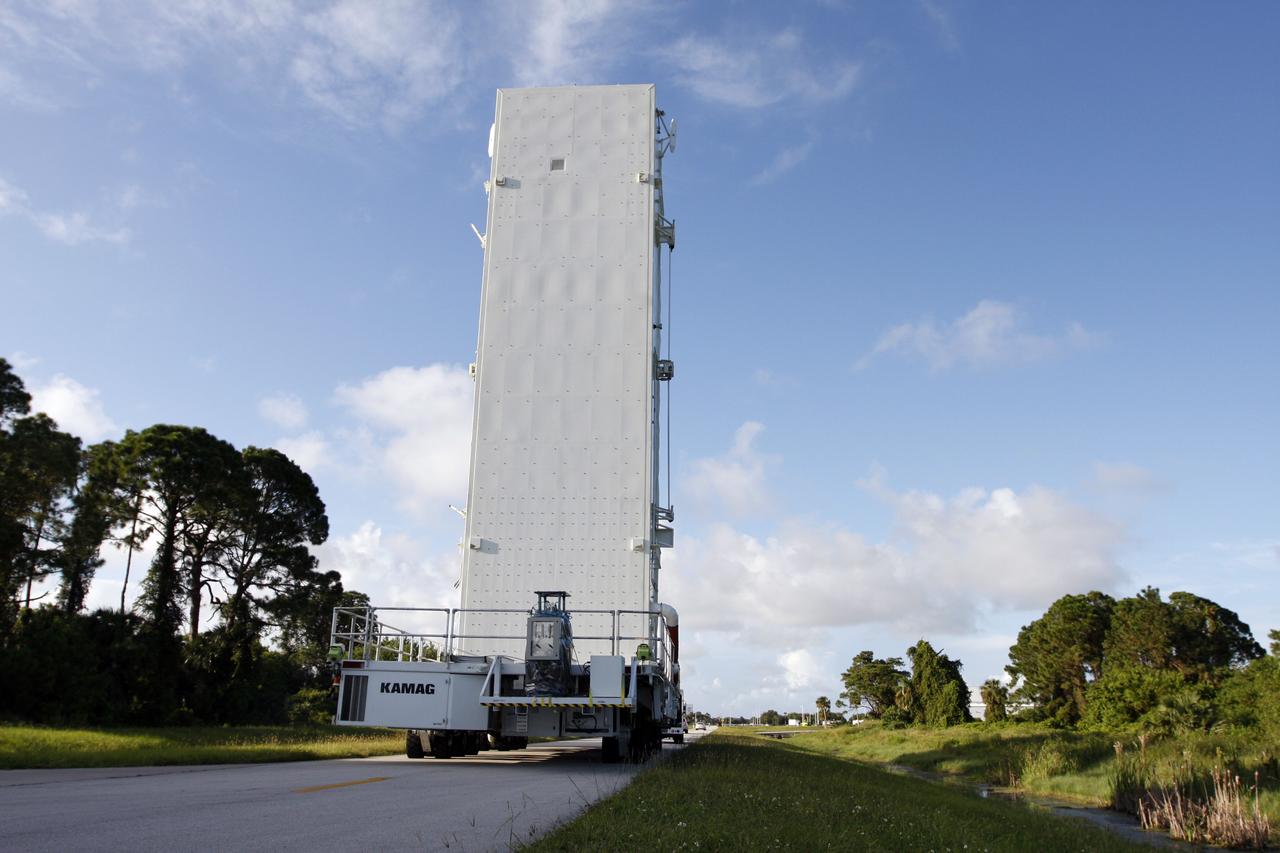 CAPE CANAVERAL, Fla. -  The payload canister makes its way from the Canister Rotation Facility at NASA's Kennedy Space Center in Florida to Launch Pad 39A. It carries a cargo of four carriers holding various equipment for the STS-125 mission aboard space shuttle Atlantis to service NASA’s Hubble Space Telescope.  At the pad, the cargo will be moved into the Payload Changeout Room.  The changeout room is the enclosed, environmentally controlled portion of the rotating service structure that supports cargo delivery to the pad and subsequent vertical installation into the shuttle’s payload bay. Launch of Atlantis is targeted for Oct. 10.  Photo credit: NASA/Troy Cryder
