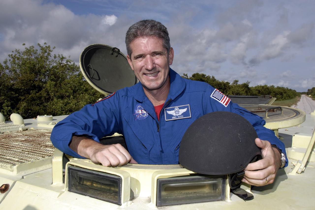 CAPE CANAVERAL, Fla. -  STS-125 Mission Specialist Michael Good is ready to practice driving the M-113 armored personnel carrier. The crew members of space shuttle Atlantis' STS-125 mission will each practice driving the M-113 in turn as part of their training on emergency egress procedures. An M-113 will be available to transport the crew to safety in the event of a contingency on the pad before their launch. The crew is at NASA's Kennedy Space Center for a dress launch rehearsal called the terminal countdown demonstration test, or TCDT. It provides astronauts and ground crews with an opportunity to participate in various simulated countdown activities, including equipment familiarization,  emergency training and a simulated launch countdown. The STS-125 mission aboard space shuttle Atlantis to service NASA’s Hubble Space Telescope is targeted to launch Oct. 10.    Photo credit: NASA/Kim Shiflett