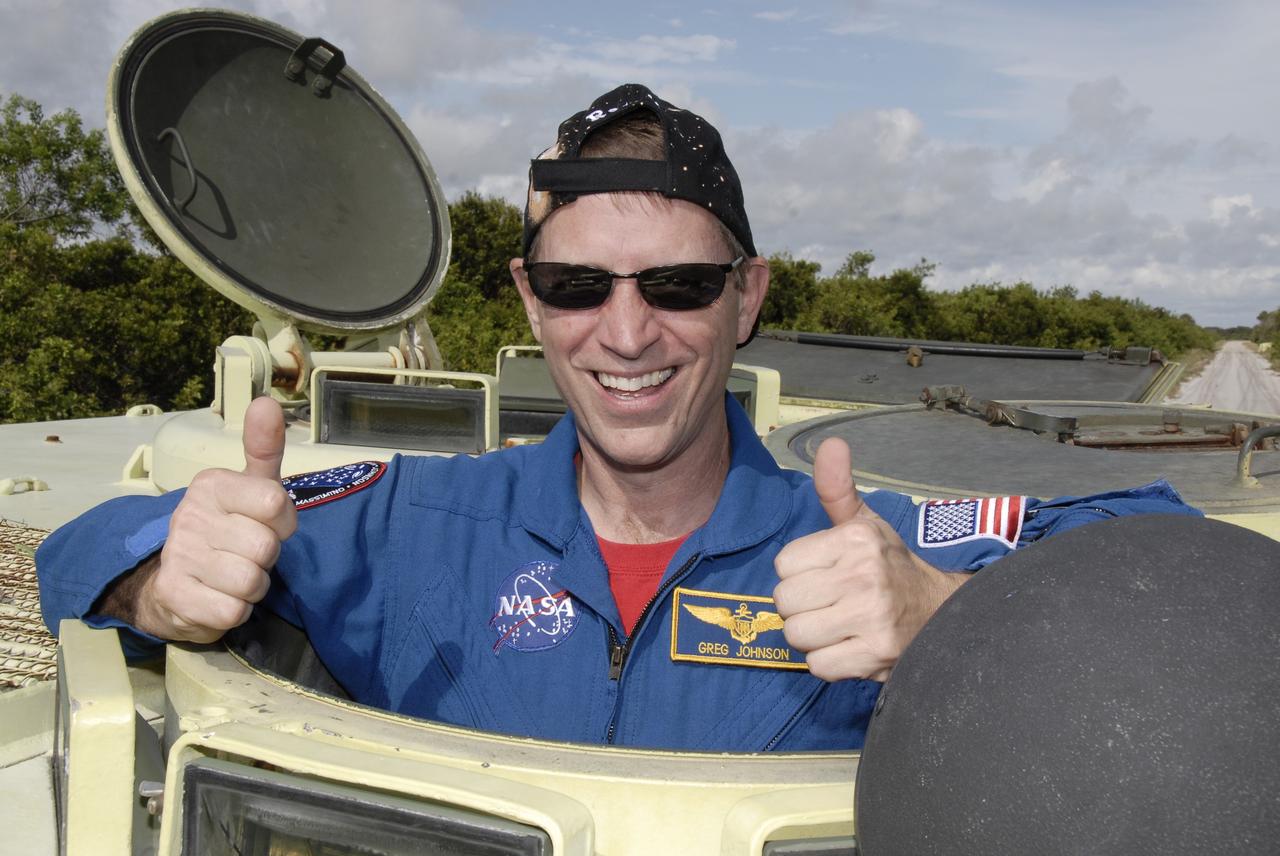 CAPE CANAVERAL, Fla. -  STS-125 Pilot Gregory C. Johnson is ready to practice driving the M-113 armored personnel carrier. The crew members of space shuttle Atlantis' STS-125 mission will each practice driving the M-113 in turn as part of their training on emergency egress procedures. An M-113 will be available to transport the crew to safety in the event of a contingency on the pad before their launch. The crew is at NASA's Kennedy Space Center for a dress launch rehearsal called the terminal countdown demonstration test, or TCDT. It provides astronauts and ground crews with an opportunity to participate in various simulated countdown activities, including equipment familiarization,  emergency training and a simulated launch countdown. The STS-125 mission aboard space shuttle Atlantis to service NASA’s Hubble Space Telescope is targeted to launch Oct. 10.    Photo credit: NASA/Kim Shiflett