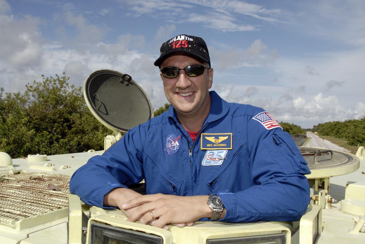 CAPE CANAVERAL, Fla. -  STS-125 Mission Specialist Mike Massimino is ready to practice driving the M-113 armored personnel carrier. The crew members of space shuttle Atlantis' STS-125 mission will each practice driving the M-113 in turn as part of their training on emergency egress procedures. An M-113 will be available to transport the crew to safety in the event of a contingency on the pad before their launch. The crew is at NASA's Kennedy Space Center for a dress launch rehearsal called the terminal countdown demonstration test, or TCDT. It provides astronauts and ground crews with an opportunity to participate in various simulated countdown activities, including equipment familiarization,  emergency training and a simulated launch countdown. The STS-125 mission aboard space shuttle Atlantis to service NASA’s Hubble Space Telescope is targeted to launch Oct. 10.    Photo credit: NASA/Kim Shiflett