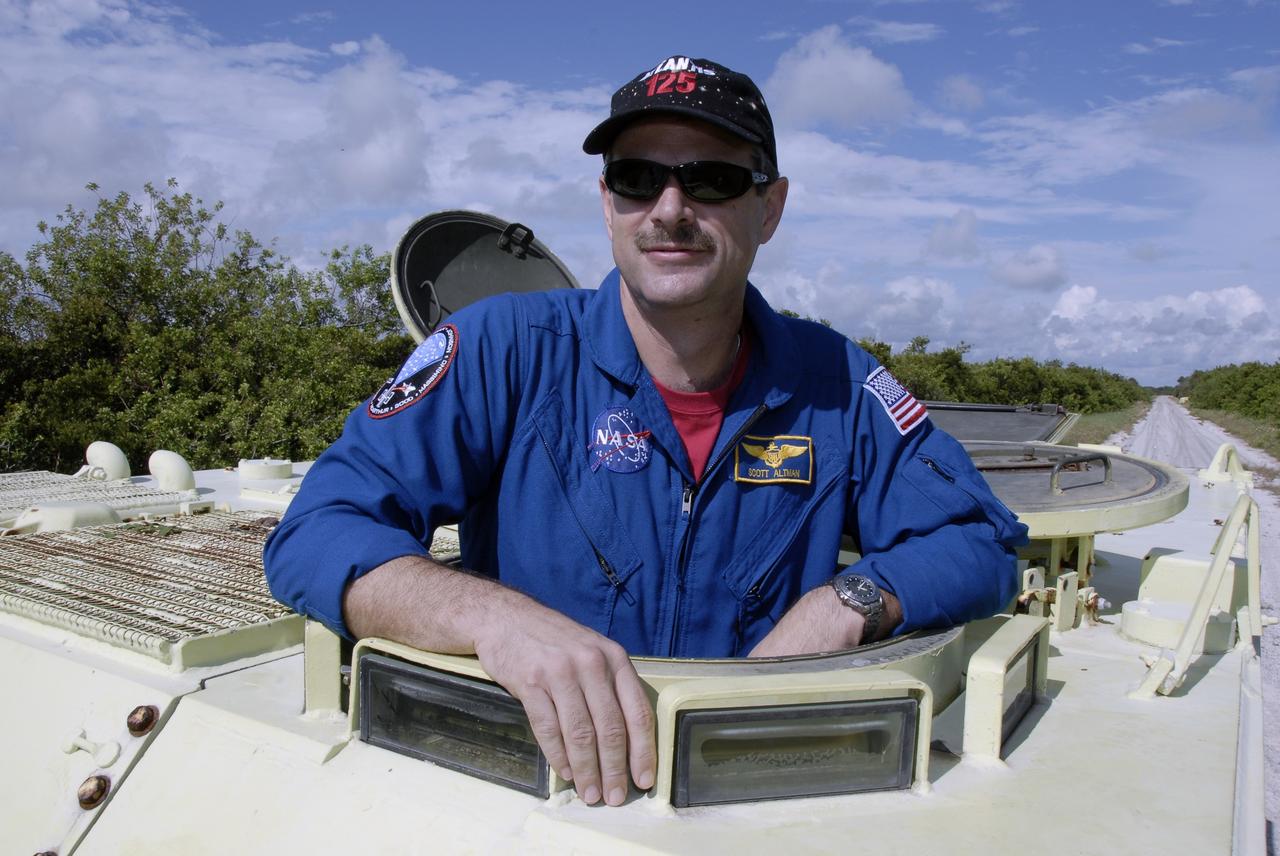 CAPE CANAVERAL, Fla. -  STS-125 Commander Scott Altman is ready to practice driving the M-113 armored personnel carrier.  The crew members of space shuttle Atlantis' STS-125 mission will each practice driving the M-113 in turn as part of their training on emergency egress procedures. An M-113 will be available to transport the crew to safety in the event of a contingency on the pad before their launch. The crew is at NASA's Kennedy Space Center for a dress launch rehearsal called the terminal countdown demonstration test, or TCDT. It provides astronauts and ground crews with an opportunity to participate in various simulated countdown activities, including equipment familiarization,  emergency training and a simulated launch countdown. The STS-125 mission aboard space shuttle Atlantis to service NASA’s Hubble Space Telescope is targeted to launch Oct. 10.    Photo credit: NASA/Kim Shiflett