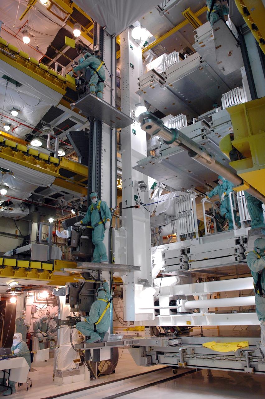 CAPE CANAVERAL, Fla. -   In the payload changeout room, or PCR, on Launch Pad 39A at NASA's Kennedy Space Center in Florida, workers prepare the payload ground-handling mechanism, or PGHM, that will transfer the cargo in the payload canister.  The cargo comprises four carriers holding various equipment for the STS-125 mission aboard space shuttle Atlantis to service NASA’s Hubble Space Telescope.  The PGHM removes payloads from a transportation canister and installs them into the shuttle. It is essentially NASA’s largest fork-lift.  Atlantis is targeted to launch Oct. 10.  Photo credit: NASA/Jim Grossmann