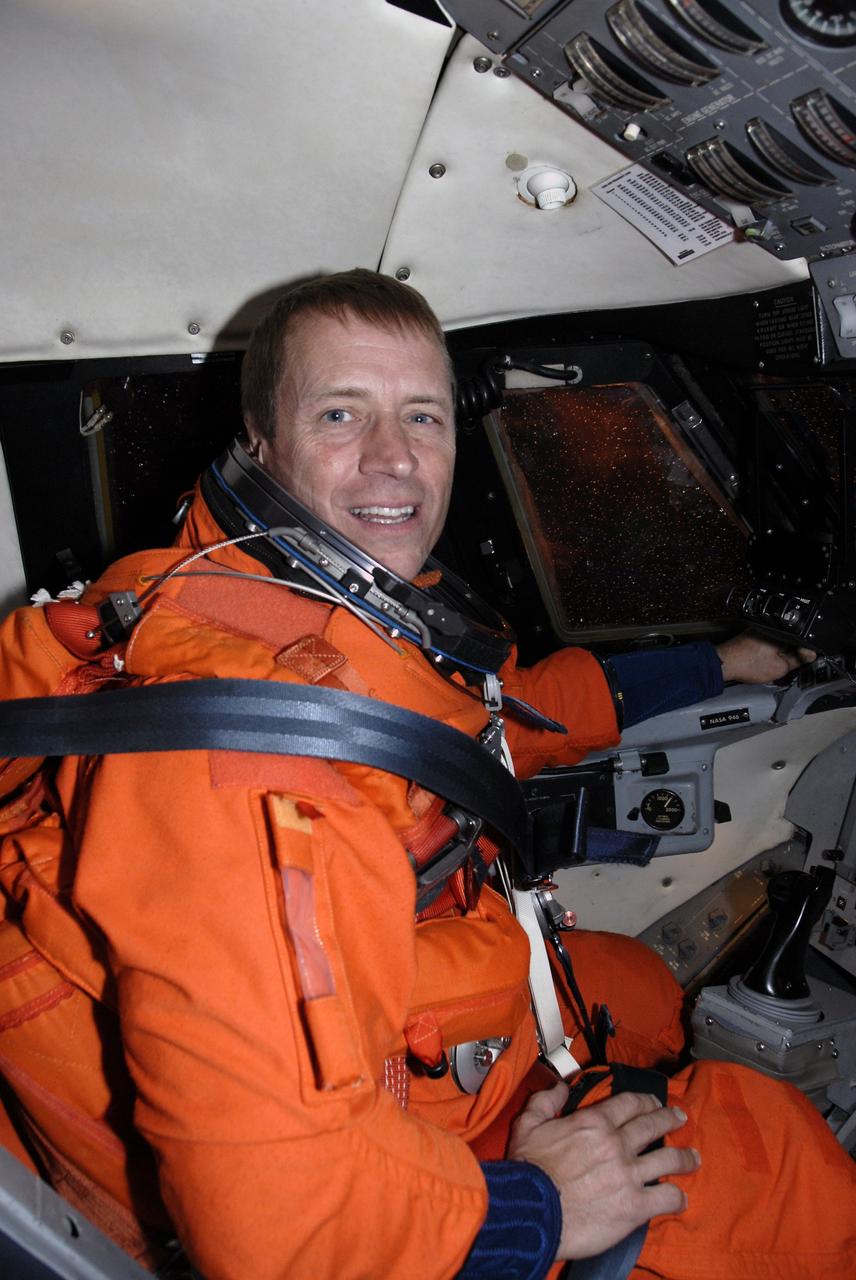 CAPE CANAVERAL, Fla. -  STS-125 Pilot Gregory C. Johnson takes his seat in the shuttle training aircraft for practice shuttle landings on the runway of the Shuttle Landing Facility at NASA's Kennedy Space Center in Florida. The STA is a Grumman American Aviation-built Gulf Stream II jet that was modified to simulate a shuttle’s cockpit, motion and visual cues, and handling qualities. In flight, the aircraft duplicates the shuttle’s atmospheric descent trajectory from approximately 35,000 feet altitude to landing on a runway. The practice is part of a terminal countdown demonstration test, or TCDT, to prepare for launch.  TCDT provides astronauts and ground crews with an opportunity to participate in various simulated countdown activities, including equipment familiarization, emergency training and a simulated launch countdown. Space shuttle Atlantis’ STS-125 mission to service NASA’s Hubble Space Telescope is targeted to launch Oct. 10.  Photo credit: NASA/Kim Shiflett