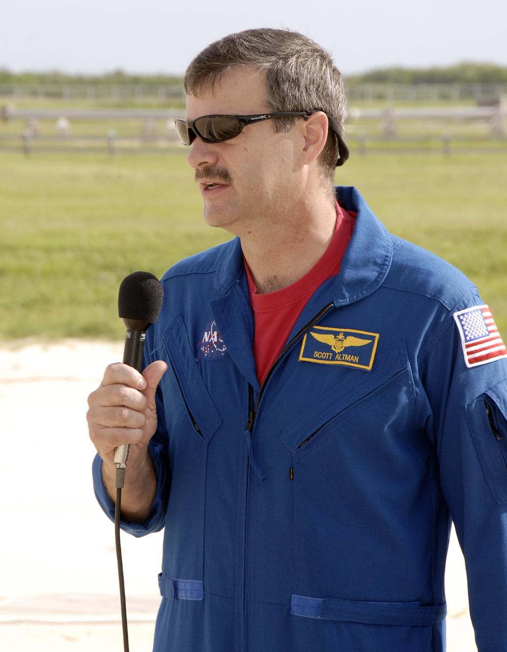 CAPE CANAVERAL, Fla. - On Launch Pad 39A at NASA's Kennedy Space Center in Florida, STS-125 Commander Scott Altman introduces his crew to the media and discusses his role in the mission. The crew is at Kennedy to take part in terminal countdown demonstration test, or TCDT, activities before launching on space shuttle Atlantis’ mission to service NASA’s Hubble Space Telescope. TCDT provides astronauts and ground crews with an opportunity to participate in various simulated countdown activities, including equipment familiarization, emergency training and a simulated launch countdown. Atlantis is targeted to launch Oct. 10. Photo credit: NASA/Kim Shiflett