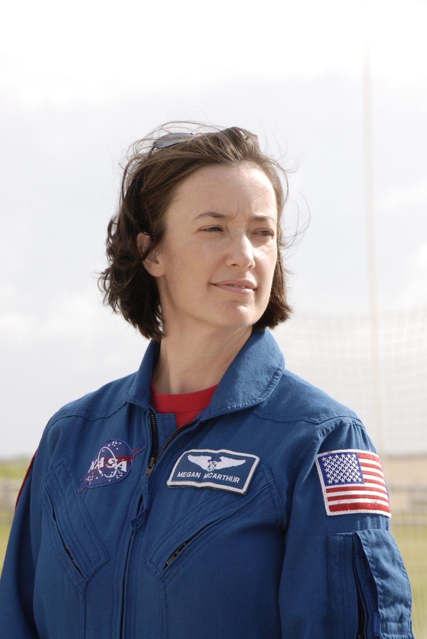 CAPE CANAVERAL, Fla. - On Launch Pad 39A at NASA's Kennedy Space Center in Florida, STS-125 Mission Specialist Megan McArthur is ready to talk to the media about her role in the mission. The crew is at Kennedy to take part in terminal countdown demonstration test, or TCDT, activities before launching on space shuttle Atlantis’ mission to service NASA’s Hubble Space Telescope. TCDT provides astronauts and ground crews with an opportunity to participate in various simulated countdown activities, including equipment familiarization, emergency training and a simulated launch countdown. Atlantis is targeted to launch Oct. 10. Photo credit: NASA/Kim Shiflett