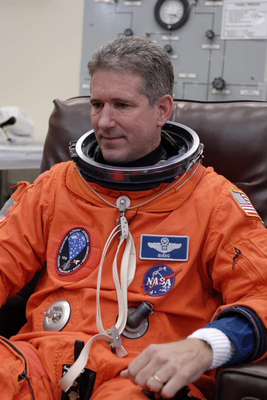 CAPE CANAVERAL, Fla. - STS-125 Mission Specialist Michael Good tries on his launch-and-entry suit to check the fit. Good will be making his first shuttle launch. His name patch reflects the nicknames the crew gave each other. The crew is at NASA's Kennedy Space Center in Florida to take part in terminal countdown demonstration test, or TCDT, activities as preparation before launch on space shuttle Atlantis’ STS-125 mission to service NASA’s Hubble Space Telescope. TCDT provides astronauts and ground crews with an opportunity to participate in various simulated countdown activities, including equipment familiarization, emergency training and a launch countdown. Atlantis is targeted to launch Oct. 14. Photo credit: NASA/Kim Shiflett