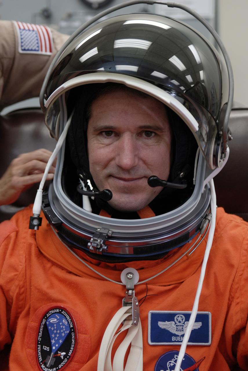 CAPE CANAVERAL, Fla. - STS-125 Mission Specialist Michael Good tries on his helmet to check the fit. Good will be making his first shuttle launch. His name patch reflects the nicknames the crew gave each other. The crew is at NASA's Kennedy Space Center in Florida to take part in terminal countdown demonstration test, or TCDT, activities as preparation before launch on space shuttle Atlantis’ STS-125 mission to service NASA’s Hubble Space Telescope. TCDT provides astronauts and ground crews with an opportunity to participate in various simulated countdown activities, including equipment familiarization, emergency training and a launch countdown. Atlantis is targeted to launch Oct. 14. Photo credit: NASA/Kim Shiflett