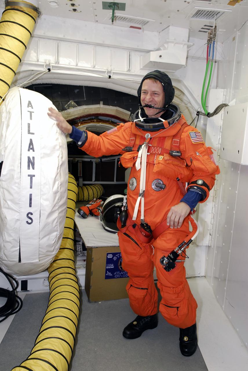 CAPE CANAVERAL, Fla. -  STS-125 Mission Specialist Andrew Feustel is ready to enter the hatch into space shuttle Atlantis for a simulated launch countdown. The countdown is the culmination of terminal countdown demonstration test, or TCDT, activities as preparation before launch.  TCDT provides astronauts and ground crews with an opportunity to participate in various launch activities, including equipment familiarization, emergency training and the countdown.  Atlantis’ STS-125 mission to service NASA’s Hubble Space Telescope is targeted for launch Oct. 14.  Photo credit: NASA/Amanda Diller