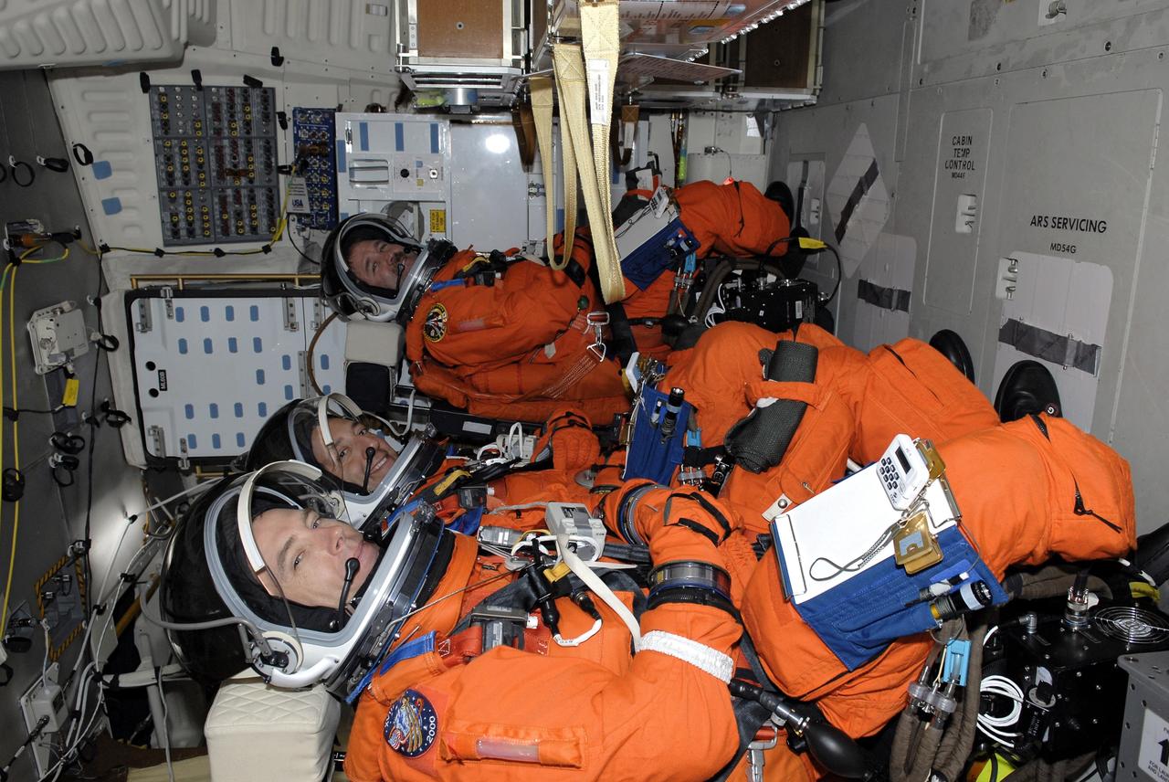 CAPE CANAVERAL, Fla. - The STS-125 crew is taking part in a simulated launch countdown aboard space shuttle Atlantis at NASA's Kennedy Space Center in Florida. Seen in their seats in the mid-deck are (front to back) Mission Specialists Andrew Feustel, Mike Massimino and John Grunsfeld. The countdown is the culmination of terminal countdown demonstration test, or TCDT, activities as preparation before launch. TCDT provides astronauts and ground crews with an opportunity to participate in various launch activities, including equipment familiarization, emergency training and the countdown. Atlantis’ STS-125 mission to service NASA’s Hubble Space Telescope is targeted for launch Oct. 14. Photo credit: NASA/Kim Shiflett