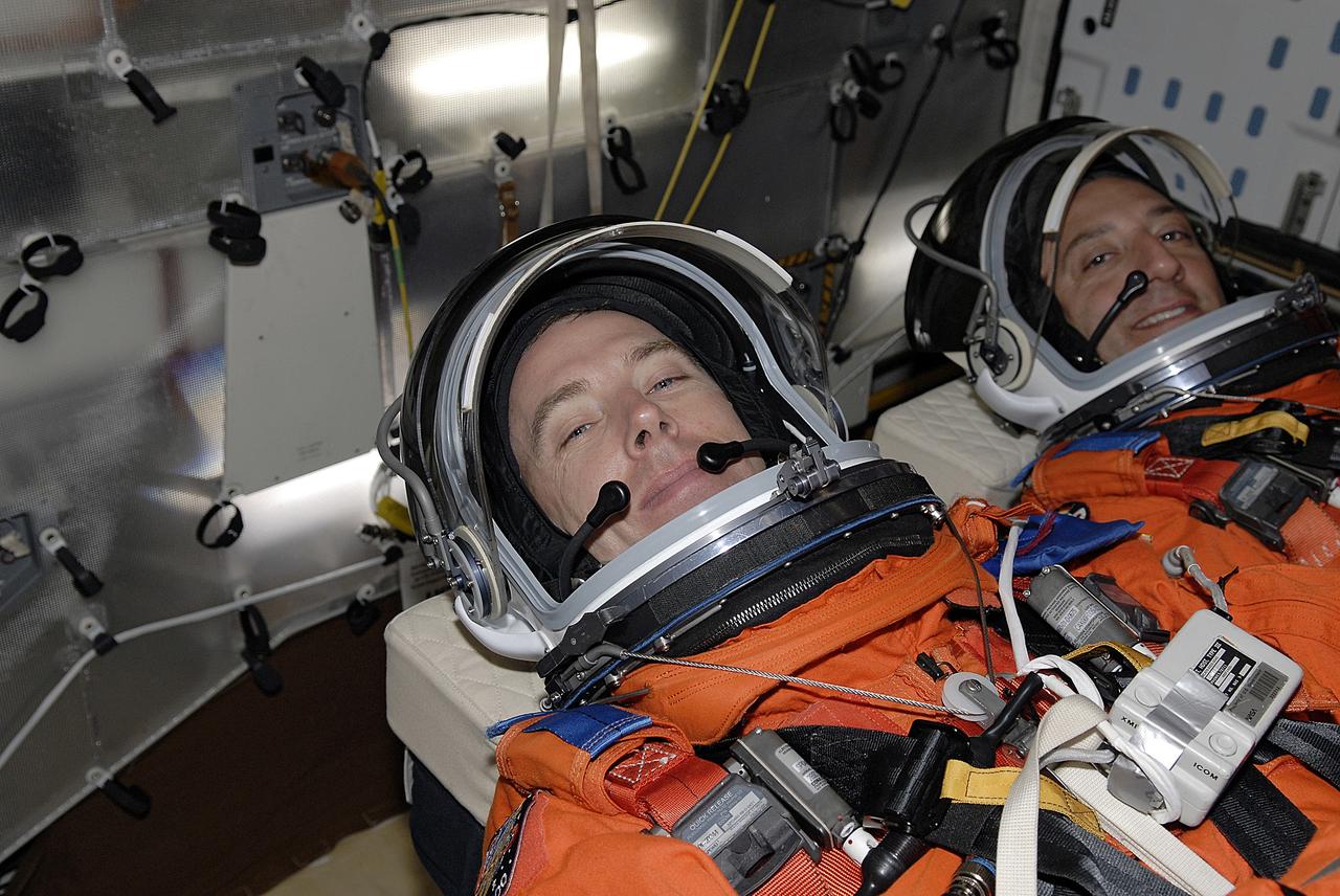 CAPE CANAVERAL, Fla. - The STS-125 crew is taking part in a simulated launch countdown aboard space shuttle Atlantis at NASA's Kennedy Space Center in Florida. Seen in their seats in the mid-deck are Mission Specialists Andrew Feustel (left) and Mike Massimino. The countdown is the culmination of terminal countdown demonstration test, or TCDT, activities as preparation before launch. TCDT provides astronauts and ground crews with an opportunity to participate in various launch activities, including equipment familiarization, emergency training and the countdown. Atlantis’ STS-125 mission to service NASA’s Hubble Space Telescope is targeted for launch Oct. 14. Photo credit: NASA/Kim Shiflett