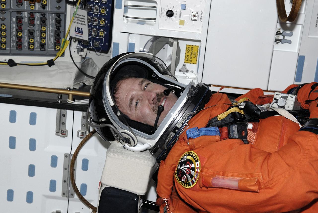 CAPE CANAVERAL, Fla. - The STS-125 crew is taking part in a simulated launch countdown aboard space shuttle Atlantis at NASA's Kennedy Space Center in Florida. Seen in his seat in the mid-deck is Mission Specialist John Grunsfeld. The countdown is the culmination of terminal countdown demonstration test, or TCDT, activities as preparation before launch. TCDT provides astronauts and ground crews with an opportunity to participate in various launch activities, including equipment familiarization, emergency training and the countdown. Atlantis’ STS-125 mission to service NASA’s Hubble Space Telescope is targeted for launch Oct. 14. Photo credit: NASA/Kim Shiflett
