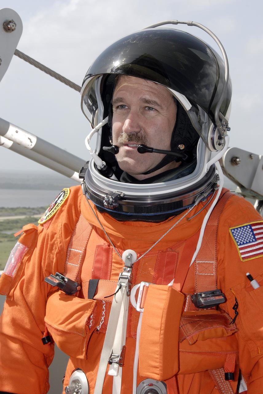 CAPE CANAVERAL, Fla. - After taking part in a simulated launch countdown aboard space shuttle Atlantis, the STS-125 crew members practice an emergency escape from the shuttle. Here Mission Specialist John Grunsfeld has reached the slidewire basket area on the fixed service structure at Launch Pad 39A at NASA's Kennedy Space Center in Florida. The countdown is the culmination of terminal countdown demonstration test, or TCDT, activities as preparation before launch. TCDT provides astronauts and ground crews with an opportunity to participate in various launch activities, including equipment familiarization, emergency training and the countdown. Atlantis’ STS-125 mission to service NASA’s Hubble Space Telescope is targeted for launch Oct. 14. Photo credit: NASA/Kim Shiflett