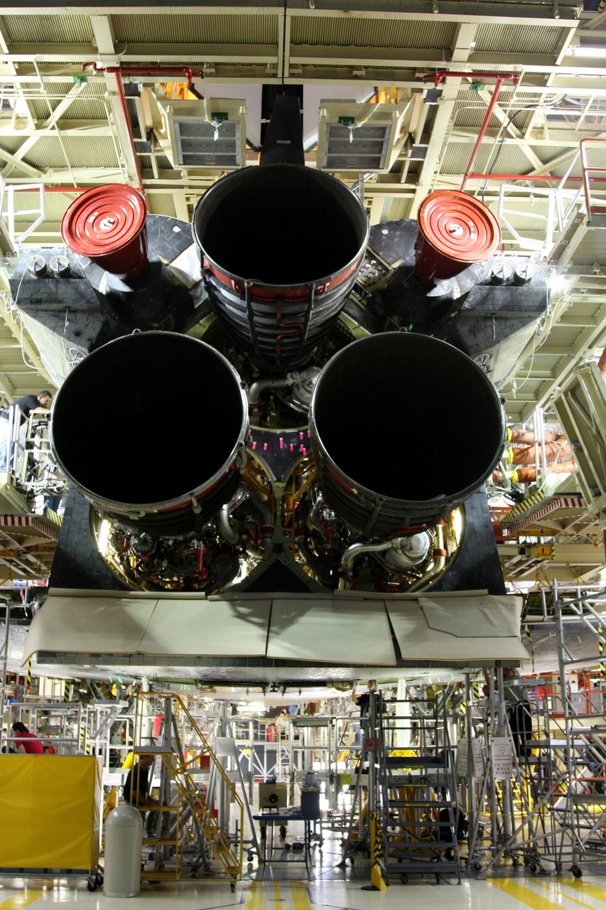 CAPE CANAVERAL, Fla. - Space shuttle main engine No. 3 (bottom left) is ready to be installed in space shuttle Discovery in Orbiter Processing Facility bay 3 at NASA's Kennedy Space Center in Florida.  Each engine is 14 feet long, weighs about 6,700 pounds, and is 7.5 feet in diameter at the end of the nozzle. Discovery is being processed for its next mission, STS-119, targeted for launch on Feb. 12, 2009. Discovery and its crew will deliver integrated truss structure 6 (S6) and solar arrays to the International Space Station. Photo credit: NASA/Dimitri Gerondidakis
