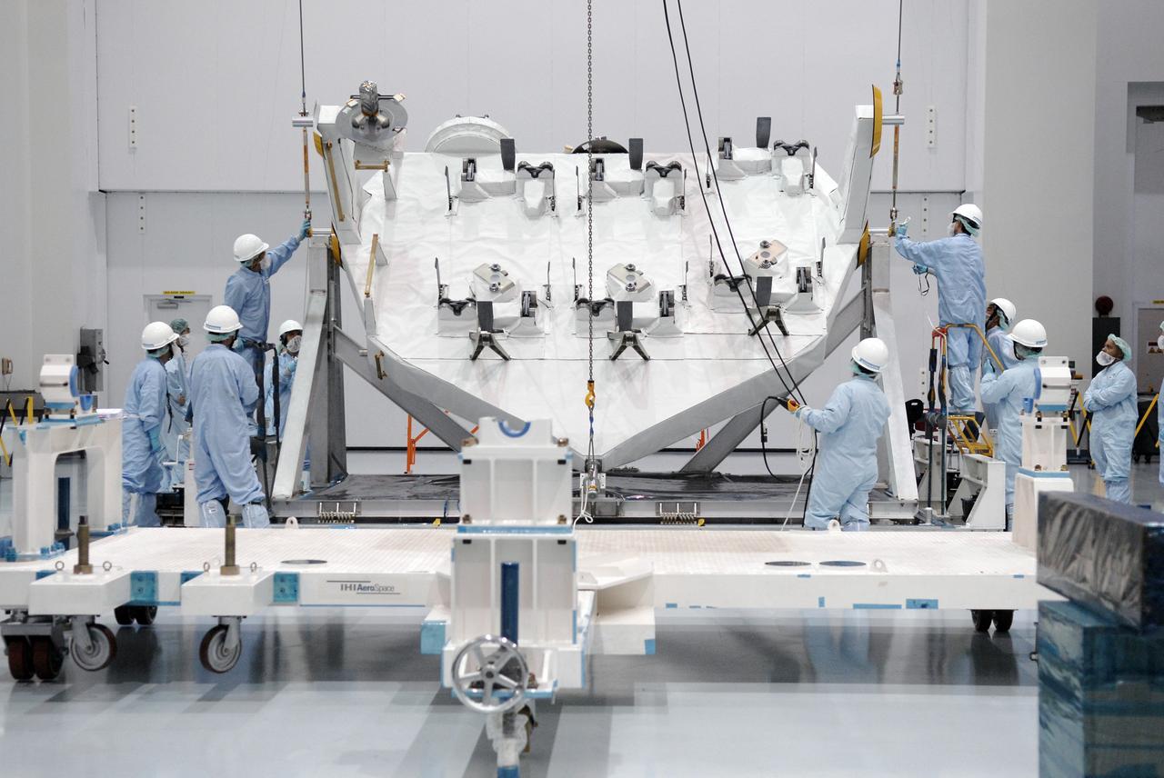 CAPE CANAVERAL, Fla. -  In the Space Station Processing Facility at NASA's Kennedy Space Center in Florida, workers connect cables to the Kibo Experiment Logistics Module Exposed Section, or ELM-ES.  The ELM-ES will be moved to a work stand.  The ELM-ES is one of the final components of the Japan Aerospace Exploration Agency's Kibo laboratory for the International Space Station.  It can provide payload storage space and can carry up to three payloads at launch. In addition, the ELM-ES provides a logistics function where it can be returned to the ground aboard the space shuttle. The ELM-ES will be carried aboard space shuttle Endeavour on the STS-127 mission targeted for launch May 15, 2009.  Photo credit: NASA/Kim Shiflett