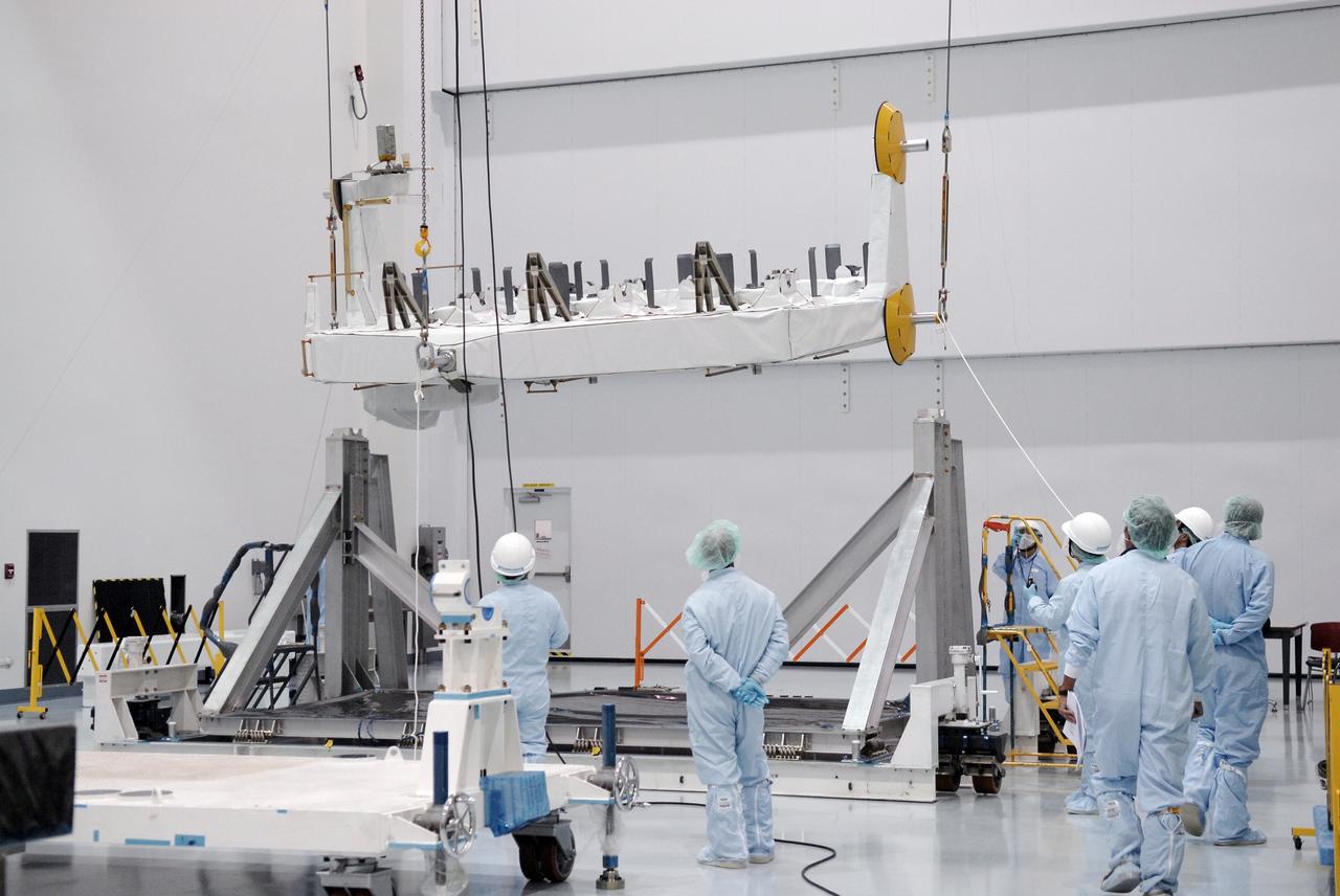CAPE CANAVERAL, Fla. -  In the Space Station Processing Facility at NASA's Kennedy Space Center in Florida, cables lift the Kibo Experiment Logistics Module Exposed Section, or ELM-ES, to move it to a work stand. The ELM-ES is one of the final components of the Japan Aerospace Exploration Agency's Kibo laboratory for the International Space Station.  It can provide payload storage space and can carry up to three payloads at launch. In addition, the ELM-ES provides a logistics function where it can be returned to the ground aboard the space shuttle. The ELM-ES will be carried aboard space shuttle Endeavour on the STS-127 mission targeted for launch May 15, 2009.  Photo credit: NASA/Kim Shiflett