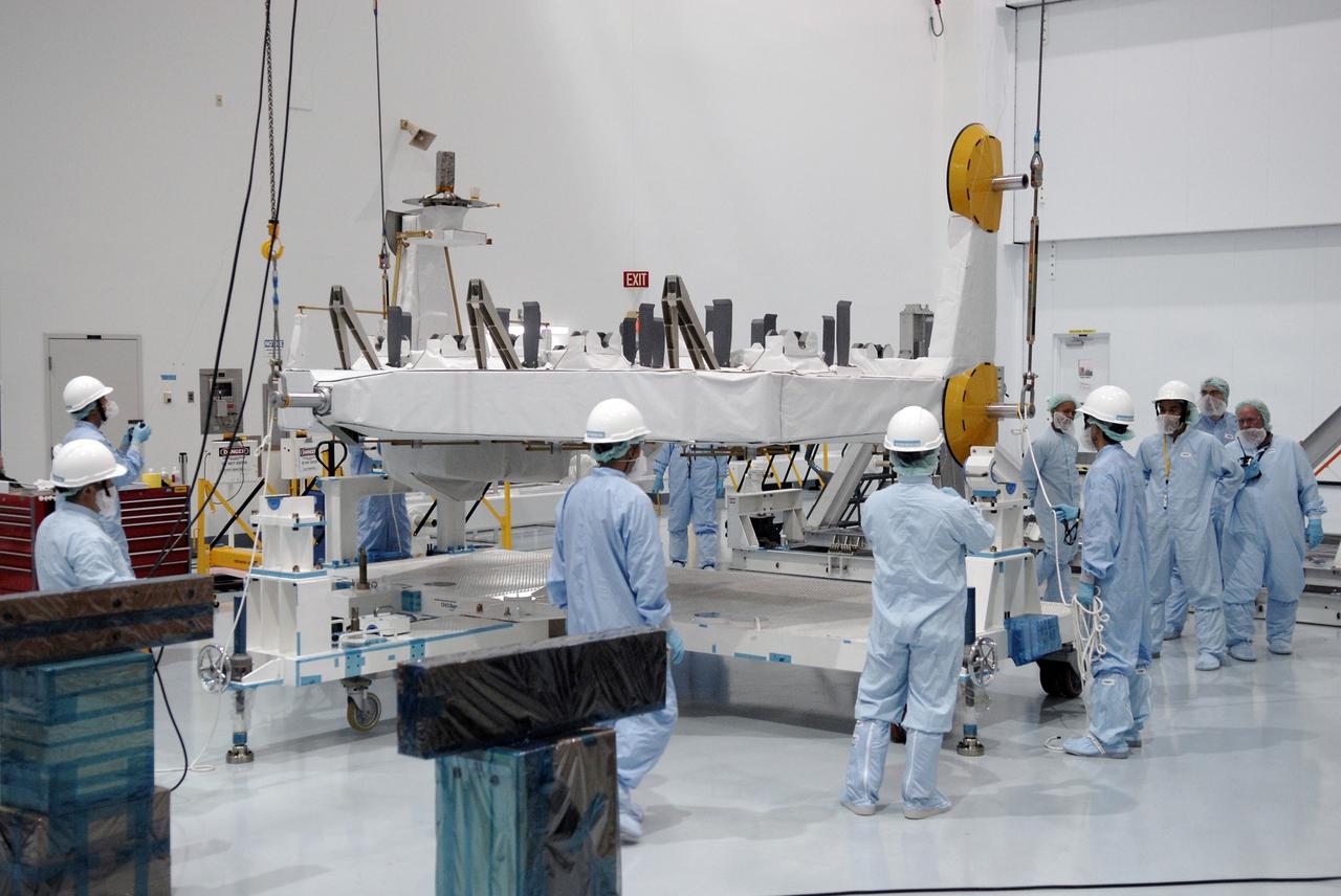 CAPE CANAVERAL, Fla. -  In the Space Station Processing Facility at NASA's Kennedy Space Center in Florida, cables lower the Kibo Experiment Logistics Module Exposed Section, or ELM-ES, onto a work stand.  The ELM-ES is one of the final components of the Japan Aerospace Exploration Agency's Kibo laboratory for the International Space Station.  It can provide payload storage space and can carry up to three payloads at launch. In addition, the ELM-ES provides a logistics function where it can be returned to the ground aboard the space shuttle. The ELM-ES will be carried aboard space shuttle Endeavour on the STS-127 mission targeted for launch May 15, 2009.  Photo credit: NASA/Kim Shiflett