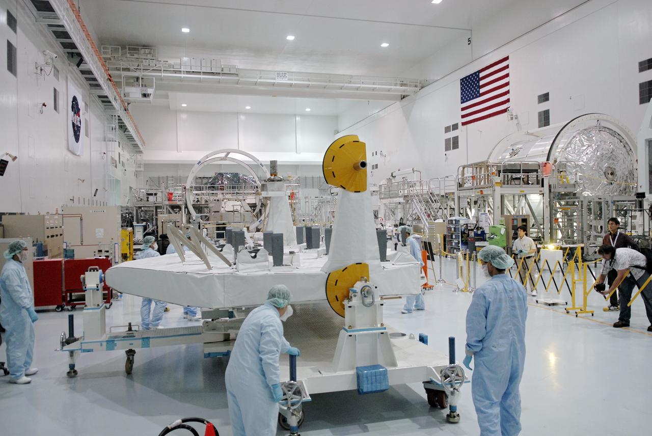 CAPE CANAVERAL, Fla. -  In the Space Station Processing Facility at NASA's Kennedy Space Center in Florida, workers secure the work stand holding the Kibo Experiment Logistics Module Exposed Section, or ELM-ES.  The ELM-ES is one of the final components of the Japan Aerospace Exploration Agency's Kibo laboratory for the International Space Station.  It can provide payload storage space and can carry up to three payloads at launch. In addition, the ELM-ES provides a logistics function where it can be returned to the ground aboard the space shuttle. The ELM-ES will be carried aboard space shuttle Endeavour on the STS-127 mission targeted for launch May 15, 2009.  Photo credit: NASA/Kim Shiflett