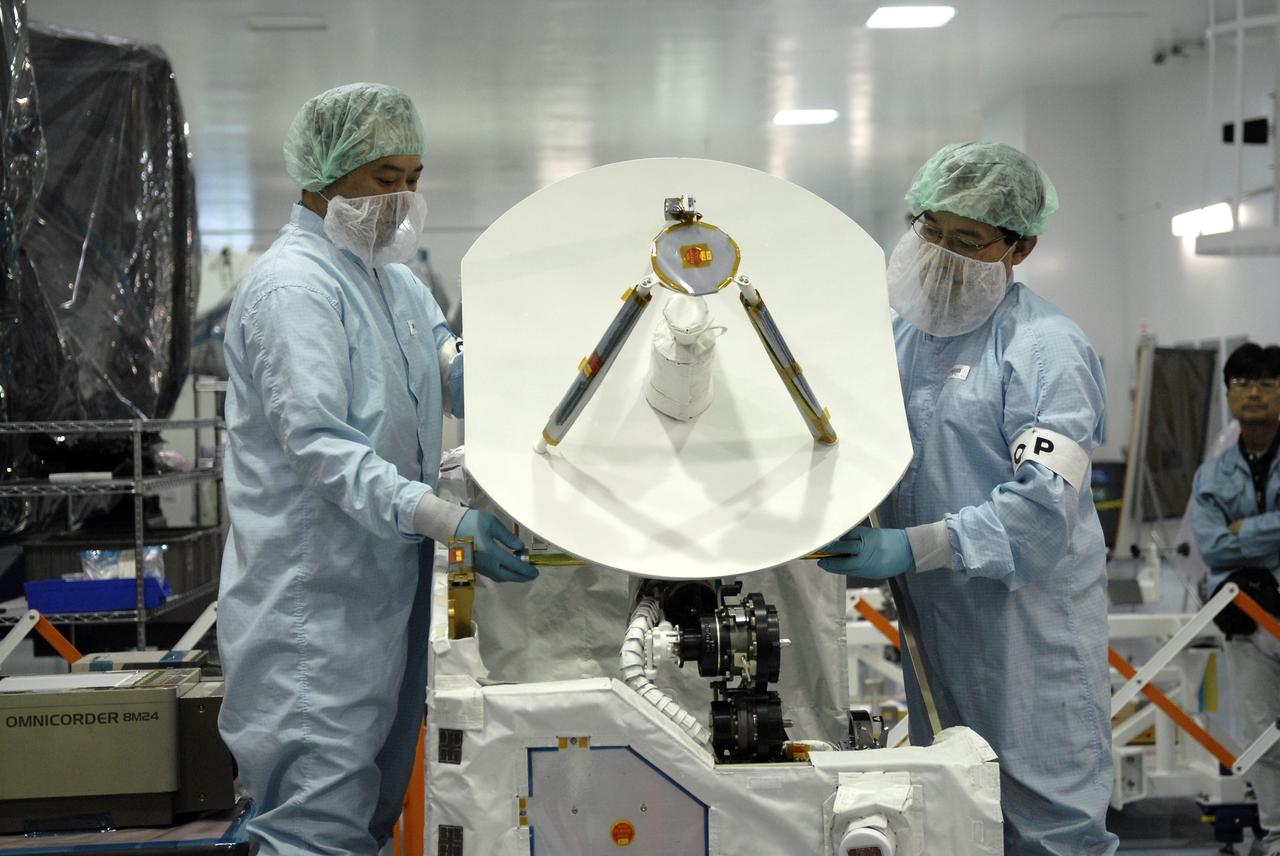 CAPE CANAVERAL, Fla. - In the Space Station Processing Facility at NASA's Kennedy Space Center in Florida, Japanese Aerospace Exploration Agency, or JAXA, technicians deploy an antenna from the Inter Orbit Communication System Extended Facility, or ICS-EF. The antenna and a pointing mechanism will be used to communicate with JAXA’s Data Relay Test Satellite, or DRTS. The ICS-EF will be launched, along with the Extended Facility and Experiment Logistics Module-Exposed Section, to the International Space Station aboard the space shuttle Endeavour on the STS-127mission targeted for launch on May 15, 2009. Photo credit: NASA/Kim Shiflett