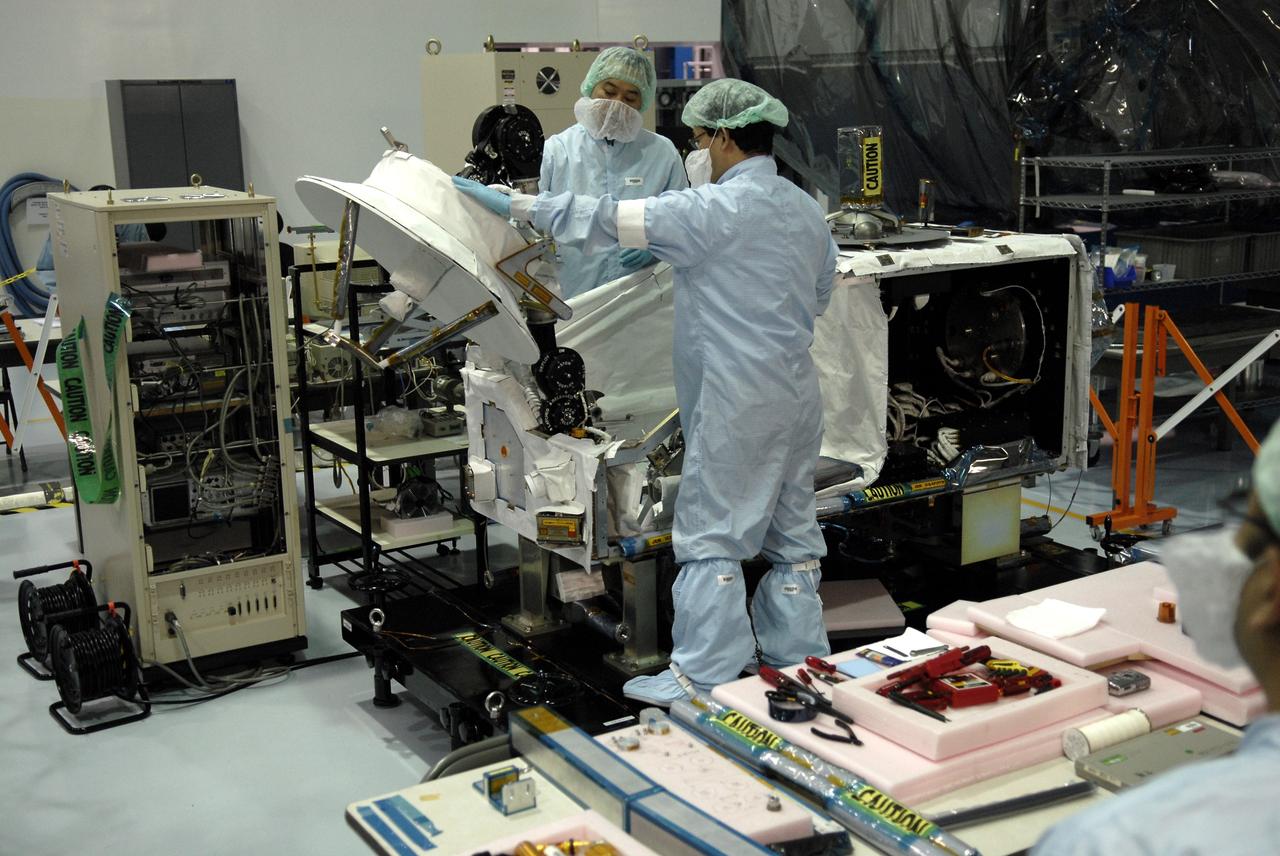 CAPE CANAVERAL, Fla. - In the Space Station Processing Facility at NASA's Kennedy Space Center in Florida, Japanese Aerospace Exploration Agency, or JAXA, technicians test the deployment of an antenna from the Inter Orbit Communication System Extended Facility, or ICS-EF. The antenna and a pointing mechanism will be used to communicate with JAXA’s Data Relay Test Satellite, or DRTS. The ICS-EF will be launched, along with the Extended Facility and Experiment Logistics Module-Exposed Section, to the International Space Station aboard the space shuttle Endeavour on the STS-127mission targeted for launch on May 15, 2009. Photo credit: NASA/Kim Shiflett