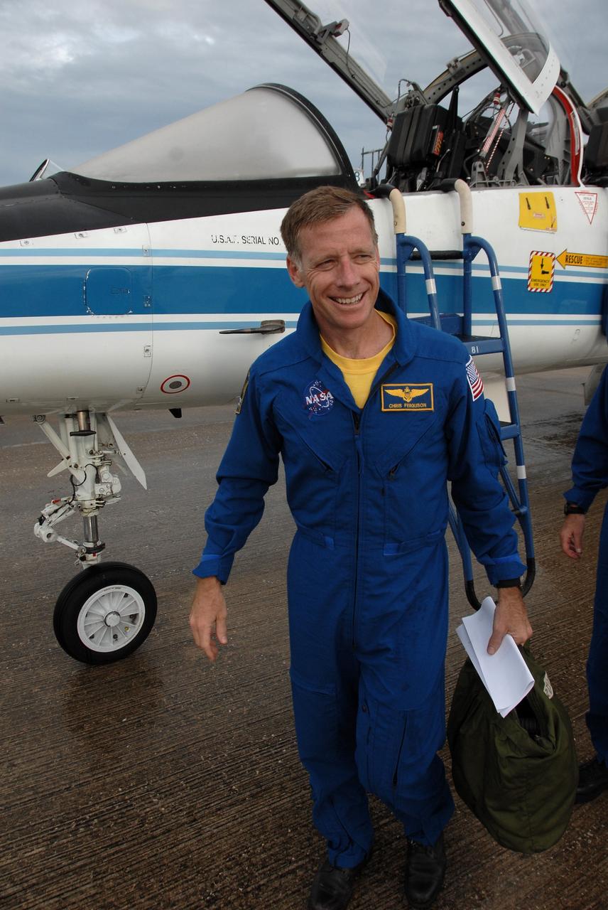 CAPE CANAVERAL, Fla. -  Space shuttle Endeavour’s STS-126 commander, Chris Ferguson, leaves the runway of the Shuttle Landing Facility at NASA's Kennedy Space Center in Florida after arriving aboard a T-38 jet trainer (behind him).  Ferguson will pilot the Shuttle Training Aircraft, or STA, to practice landing a shuttle on the runway of the Shuttle Landing Facility. The STA is a Grumman American Aviation-built Gulf Stream II jet that was modified to simulate a shuttle’s cockpit, motion and visual cues, and handling qualities. In flight, the aircraft duplicates the shuttle’s atmospheric descent trajectory from approximately 35,000 feet altitude to landing on a runway. Ferguson previously served as pilot on the STS-115 mission, which flew in September 2006.  The STS-126 mission to the International Space Station is targeted to launch Nov. 16.  Photo credit: NASA/Cory Huston