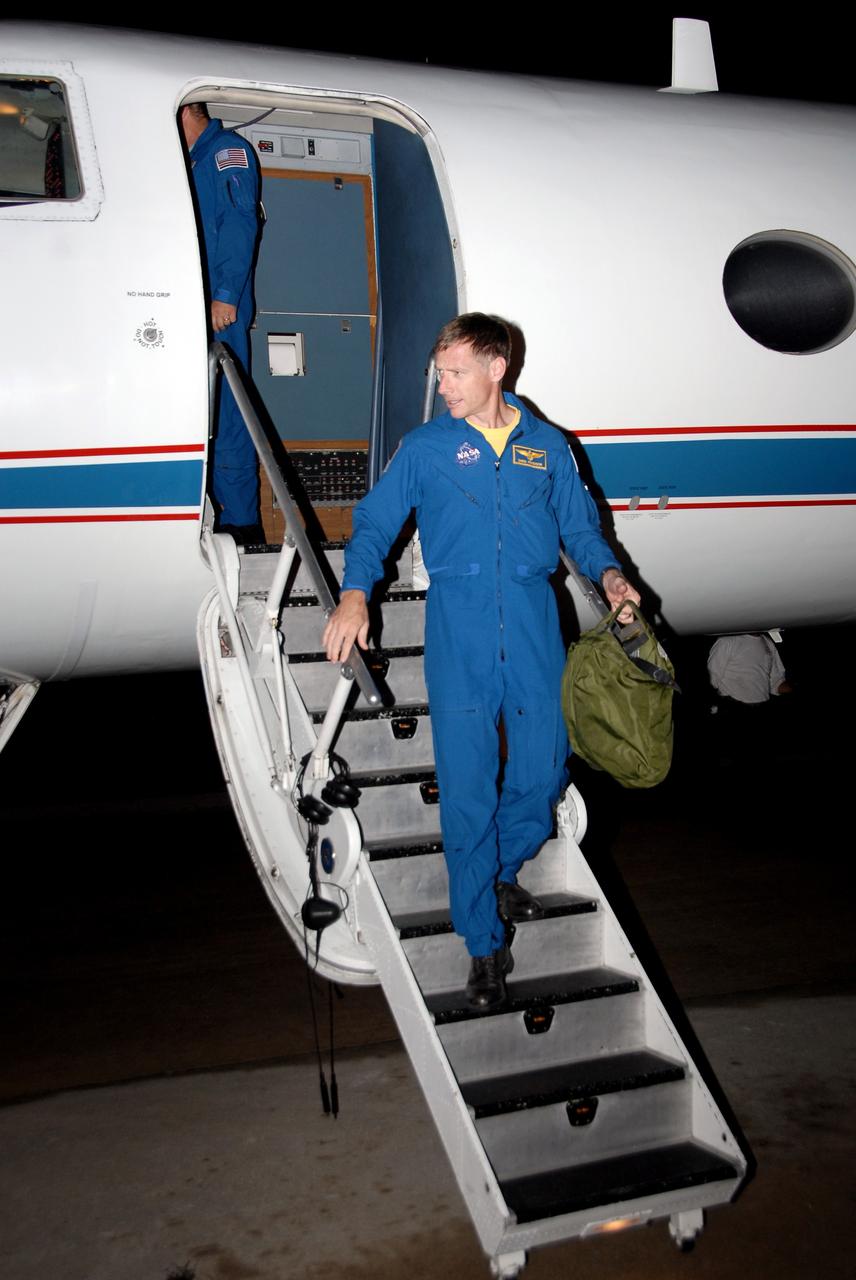 CAPE CANAVERAL, Fla. -  On the Shuttle Landing Facility at NASA's Kennedy Space Center in Florida, space shuttle Endeavour’s STS-126 commander, Chris Ferguson, exits the Shuttle Training Aircraft, or STA.  Ferguson flew the STA to practice landing the shuttle on the runway. The STA is a Grumman American Aviation-built Gulf Stream II jet that was modified to simulate a shuttle’s cockpit, motion and visual cues, and handling qualities. In flight, the aircraft duplicates the shuttle’s atmospheric descent trajectory from approximately 35,000 feet altitude to landing on a runway. Ferguson previously served as pilot on the STS-115 mission, which flew in September 2006.  The STS-126 mission to the International Space Station is targeted to launch Nov. 16.  Photo credit: NASA/Cory Huston