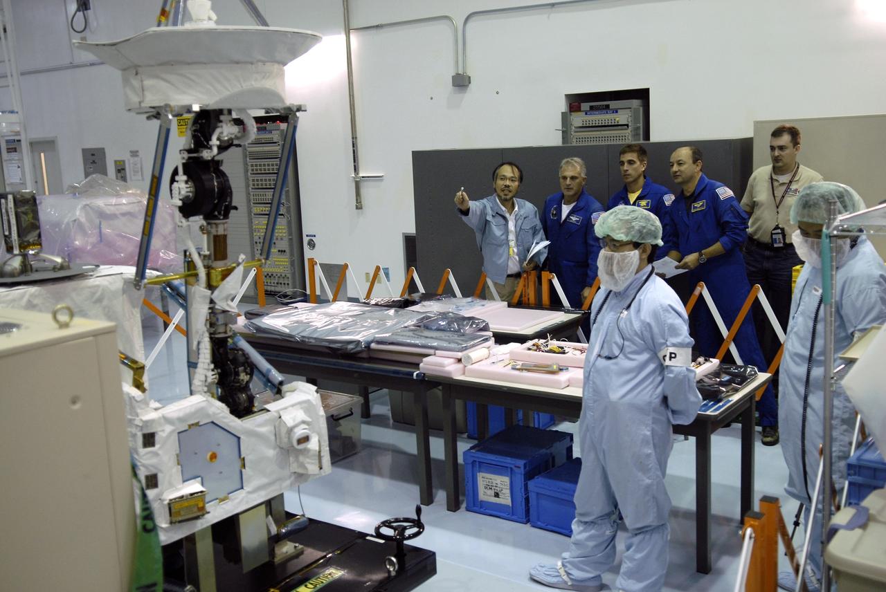 CAPE CANAVERAL, Fla. - In the Space Station Processing Facility at NASA's Kennedy Space Center in Florida, STS-127 crew members get a look at the antenna in the Inter Orbit Communication System Extended Facility, or ICS-EF. Standing next to a Japanese Aerospace Exploration Agency, or JAXA, technician at left are Mission Specialists Dave Wolf and Christopher Cassidy and Commander Mark Polansky. Equipment familiarization is part of a Crew Equipment Interface Test. The antenna and a pointing mechanism will be used to communicate with JAXA’s Data Relay Test Satellite, or DRTS. The ICS-EF will be launched, along with the Extended Facility and Experiment Logistics Module-Exposed Section, to the International Space Station aboard the space shuttle Endeavour on the STS-127 mission targeted for launch on May 15, 2009. Photo credit: NASA/Kim Shiflett