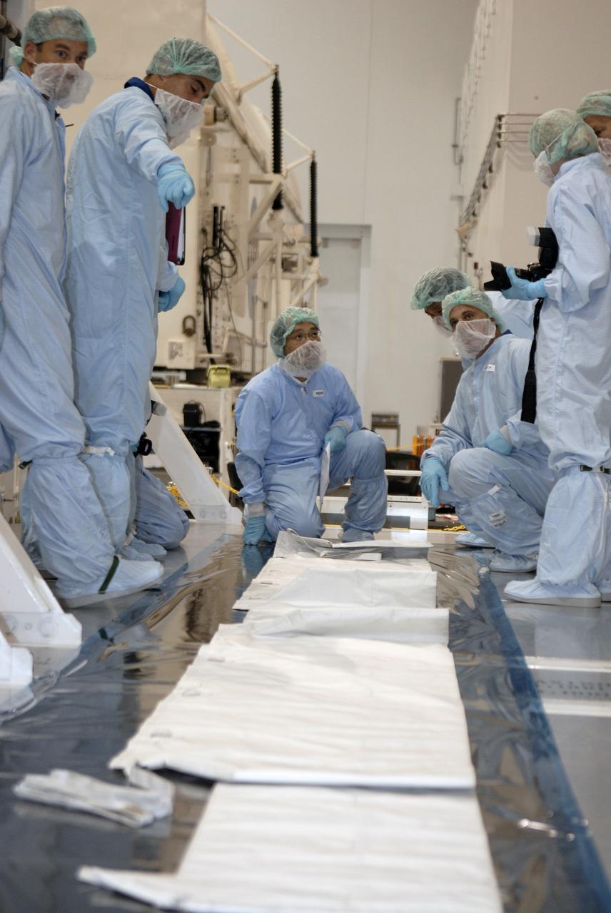 CAPE CANAVERAL, Fla. -  In the Space Station Processing Facility at NASA's Kennedy Space Center in Florida, STS-127 crew members get a close look at equipment for their mission, which will install final components of the Japanese Aerospace Exploration Agency’s Japanese Experiment Module.  Equipment familiarization is part of a Crew Equipment Interface Test. The JEM components include the Inter Orbit Communication System Extended Facility, or ICS-EF, the Extended Facility and Experiment Logistics Module-Exposed Section. The payload will launch aboard  space shuttle Endeavour targeted for May 15, 2009. Photo credit: NASA/Kim Shiflett